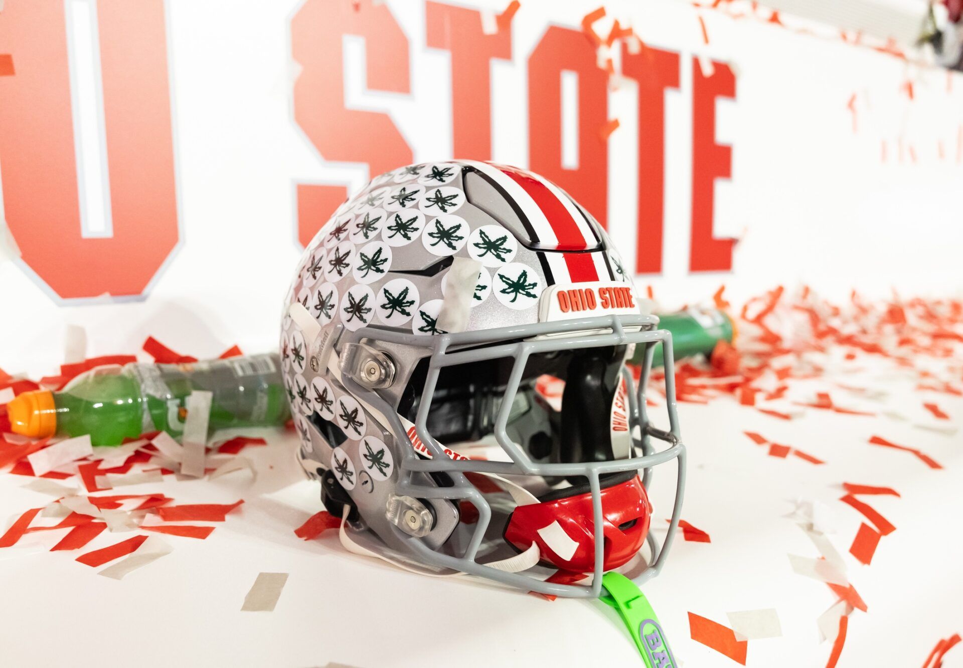 Detailed view of confetti with an Ohio State Buckeyes helmet after winning the CFP National Championship college football game at Mercedes-Benz Stadium.