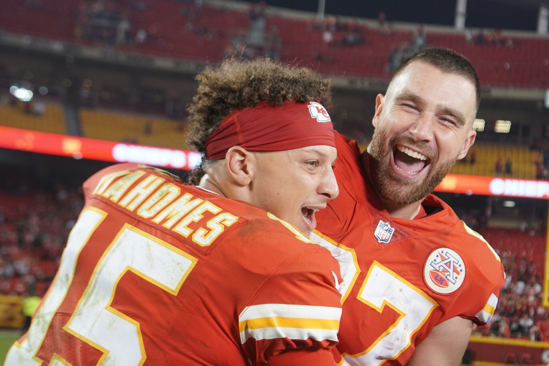 Kansas City Chiefs quarterback Patrick Mahomes (15) interrupts tight end Travis Kelce (87) while talking with a report after the game against the Las Vegas Raiders at GEHA Field at Arrowhead Stadium.