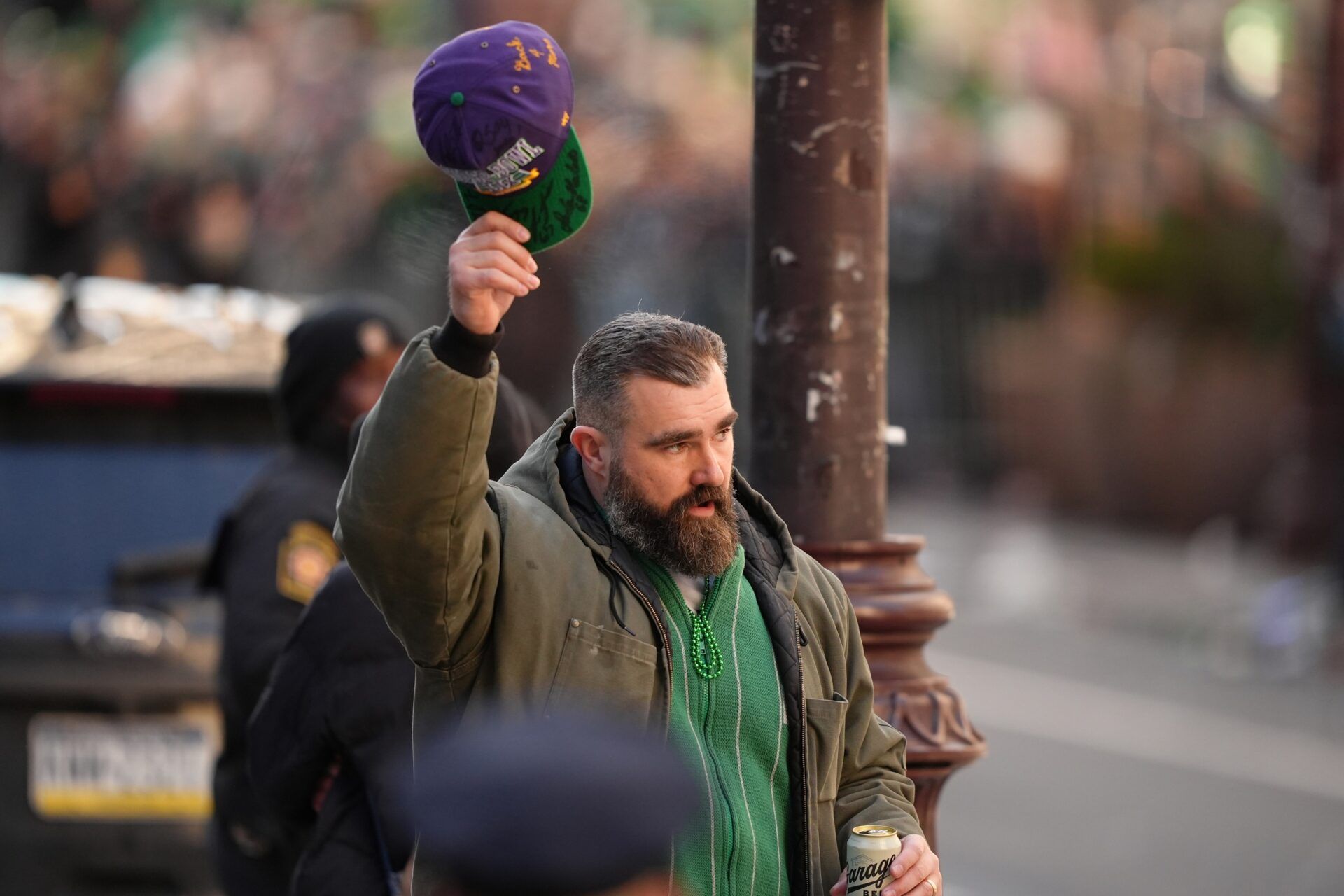 Jason Kelce gestures to fans during the Super Bowl LIX championship parade and rally.