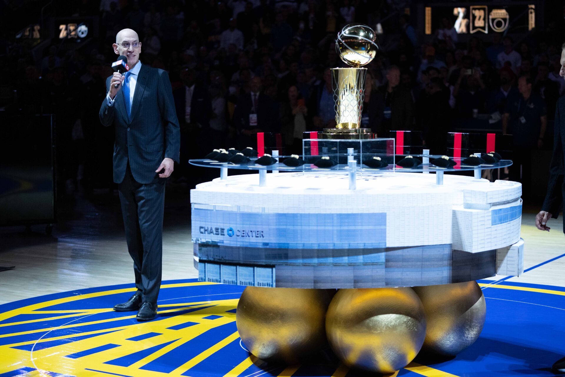 NBA commissioner Adam Silver speaks next to the Larry O'Brien Championship Trophy and championship rings before the game between the Golden State Warriors and the Los Angeles Lakers at Chase Center.