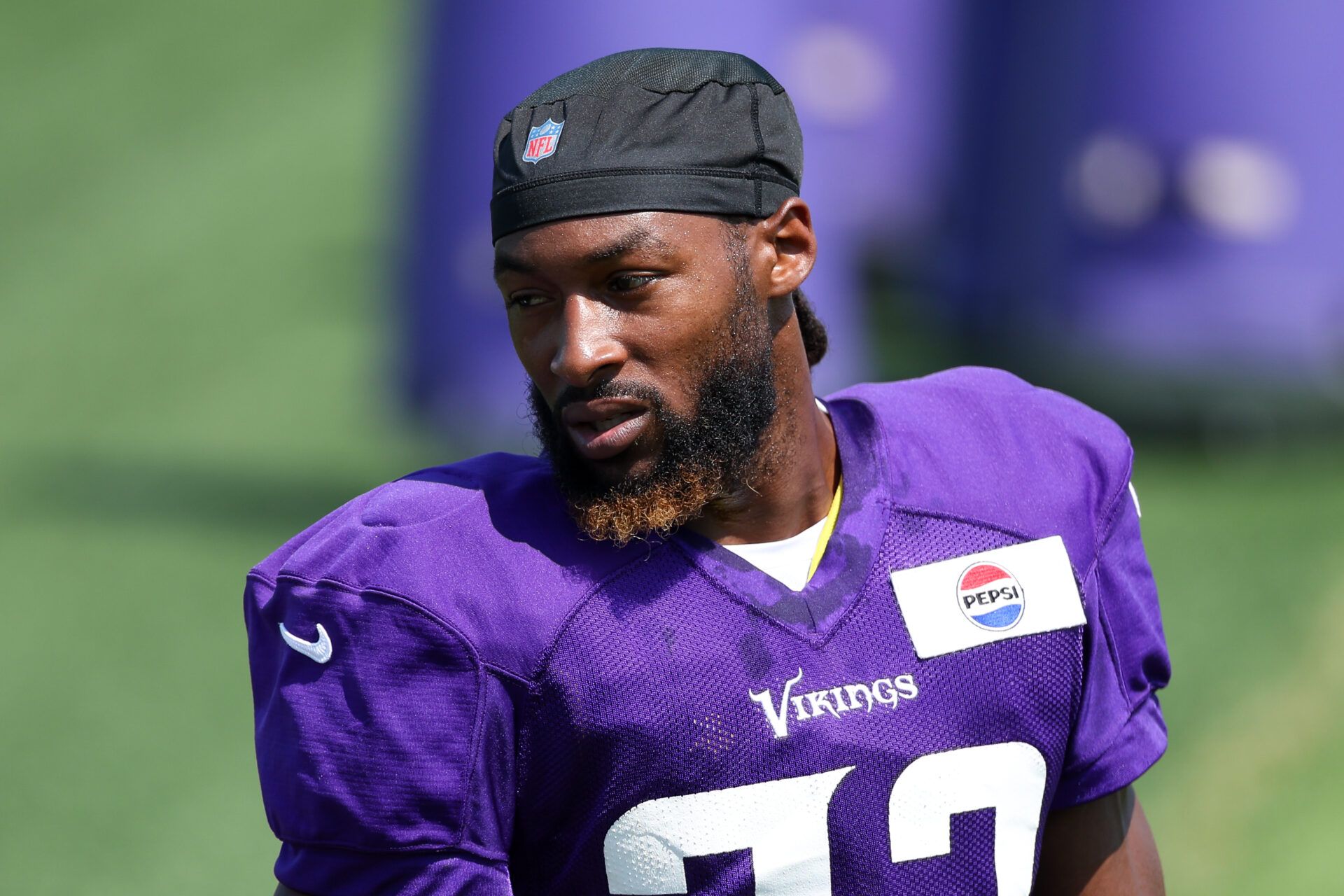Minnesota Vikings running back Aaron Jones Sr. (33) looks on during the teams training camp at the Minnesota Vikings Training Facility.