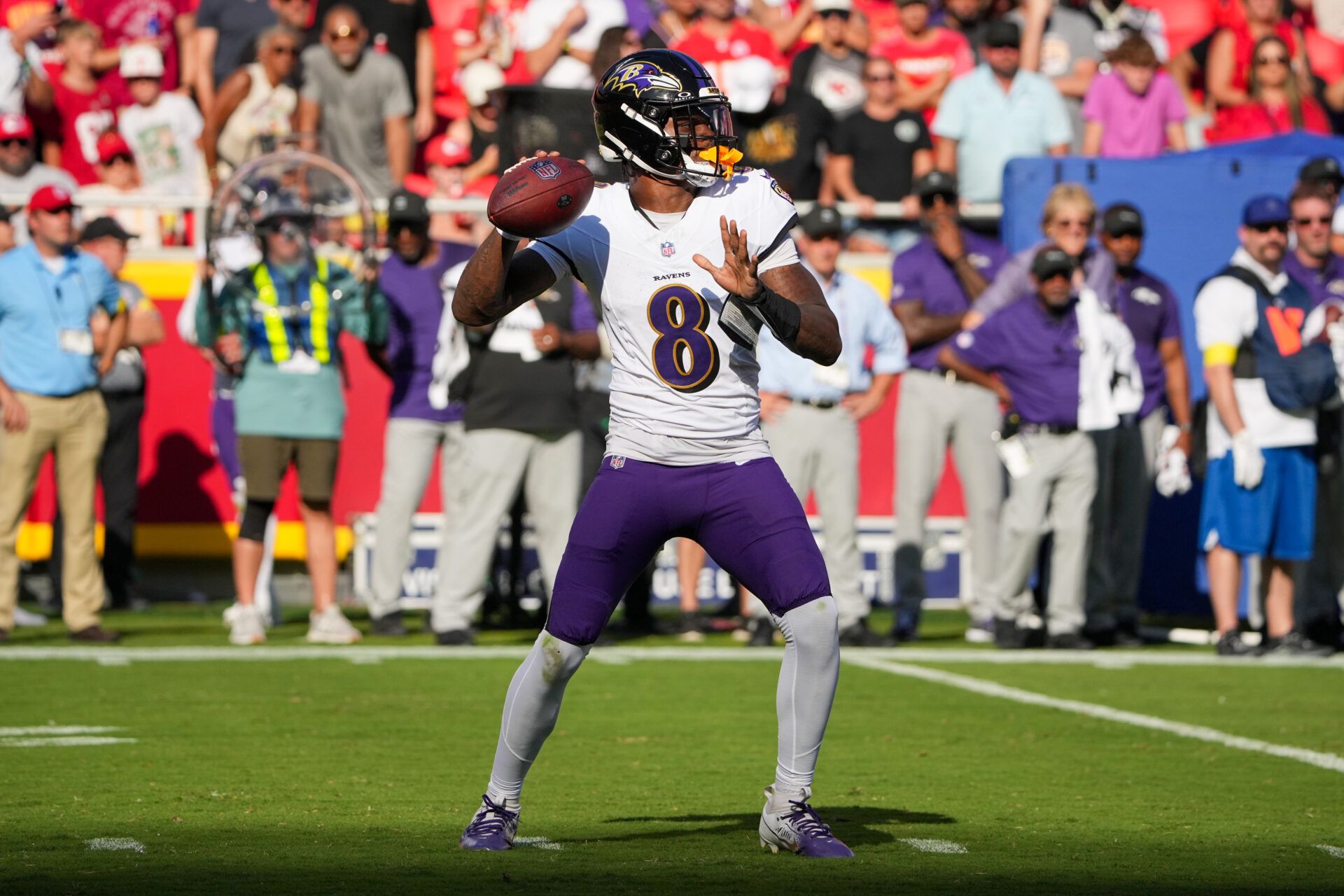 Baltimore Ravens quarterback Lamar Jackson (8) throws a pass against the Kansas City Chiefs during the game at GEHA Field at Arrowhead Stadium.