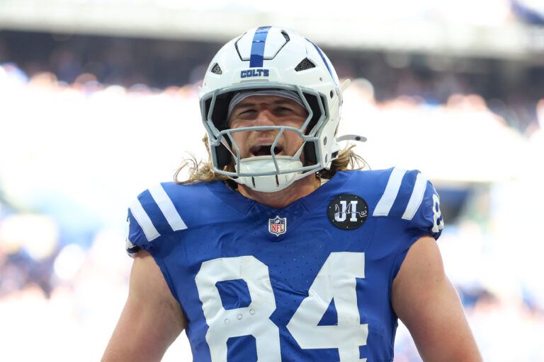 Indianapolis Colts tight end Tyler Warren (84) celebrates after scoring a touchdown against the Arizona Cardinals during the first quarter of the game at Lucas Oil Stadium.
