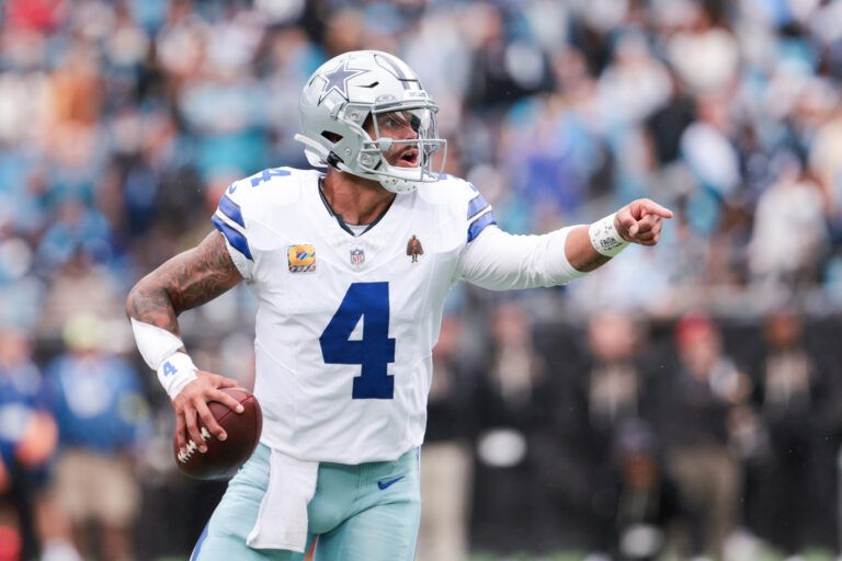 Dallas Cowboys quarterback Dak Prescott (4) communicates during the second half against the Carolina Panthers at Bank of America Stadium.
