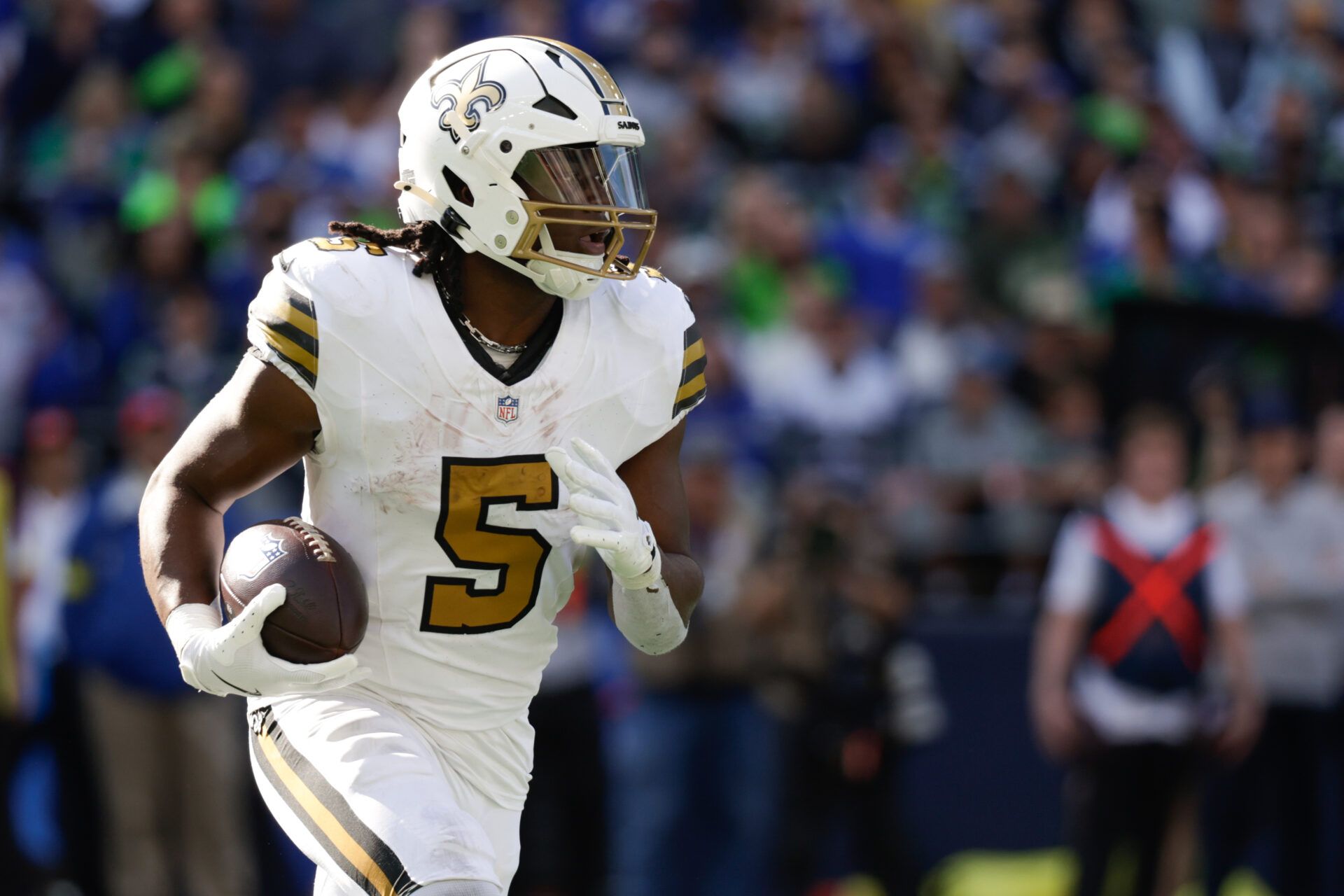 New Orleans Saints running back Kendre Miller (5) runs the ball during the third quarter against the Seattle Seahawks at Lumen Field.