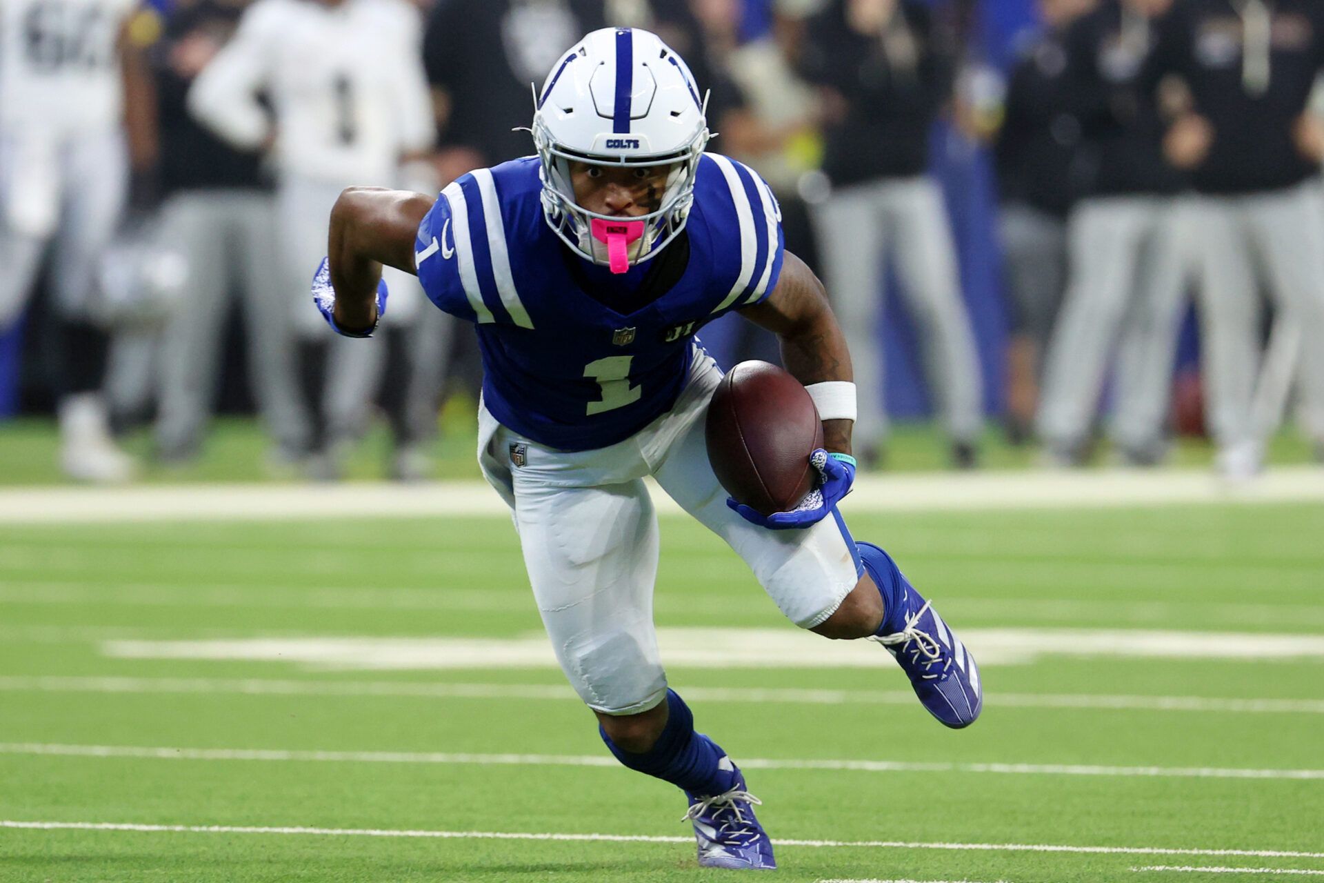 Indianapolis Colts wide receiver Josh Downs (1) runs with the ball against the Las Vegas Raiders during the second half at Lucas Oil Stadium.