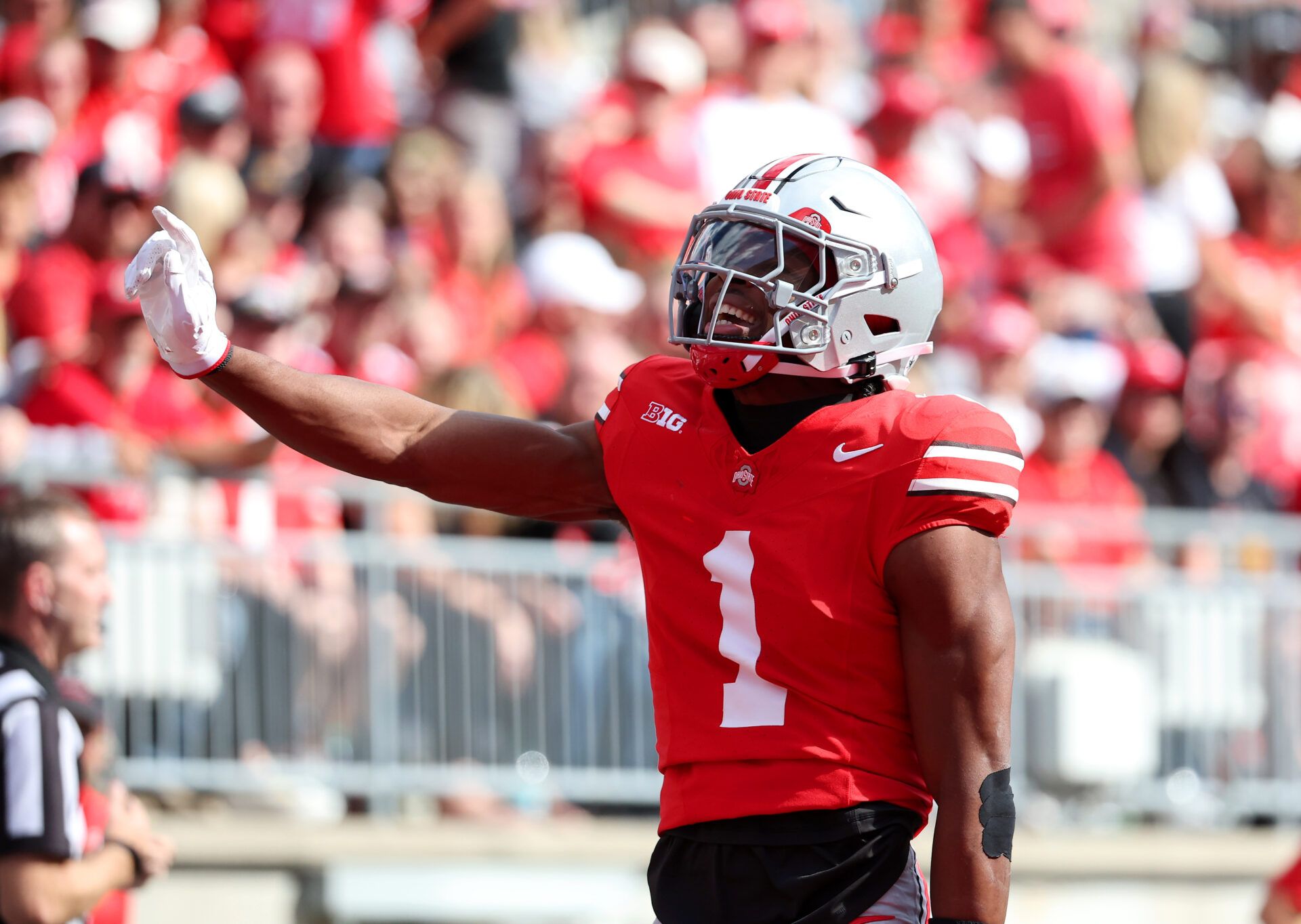 Ohio State Buckeyes cornerback Davison Igbinosun (1) celebrates his pass break up during the second quarter against the Grambling State Tigers at Ohio Stadium.