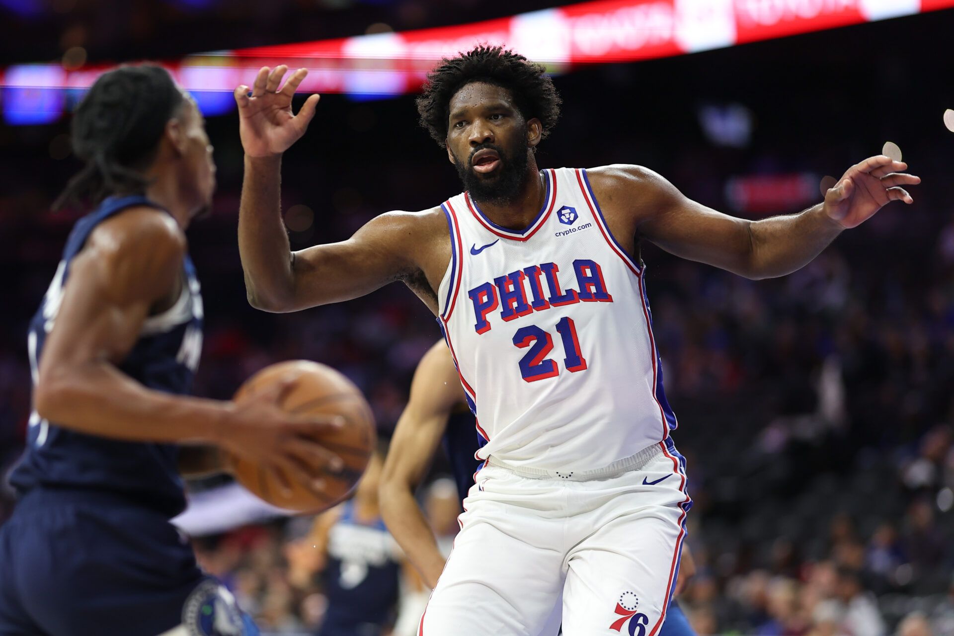 Philadelphia 76ers center Joel Embiid (21) defends against Minnesota Timberwolves guard Rob Dillingham (4) during the first quarter at Xfinity Mobile Arena.