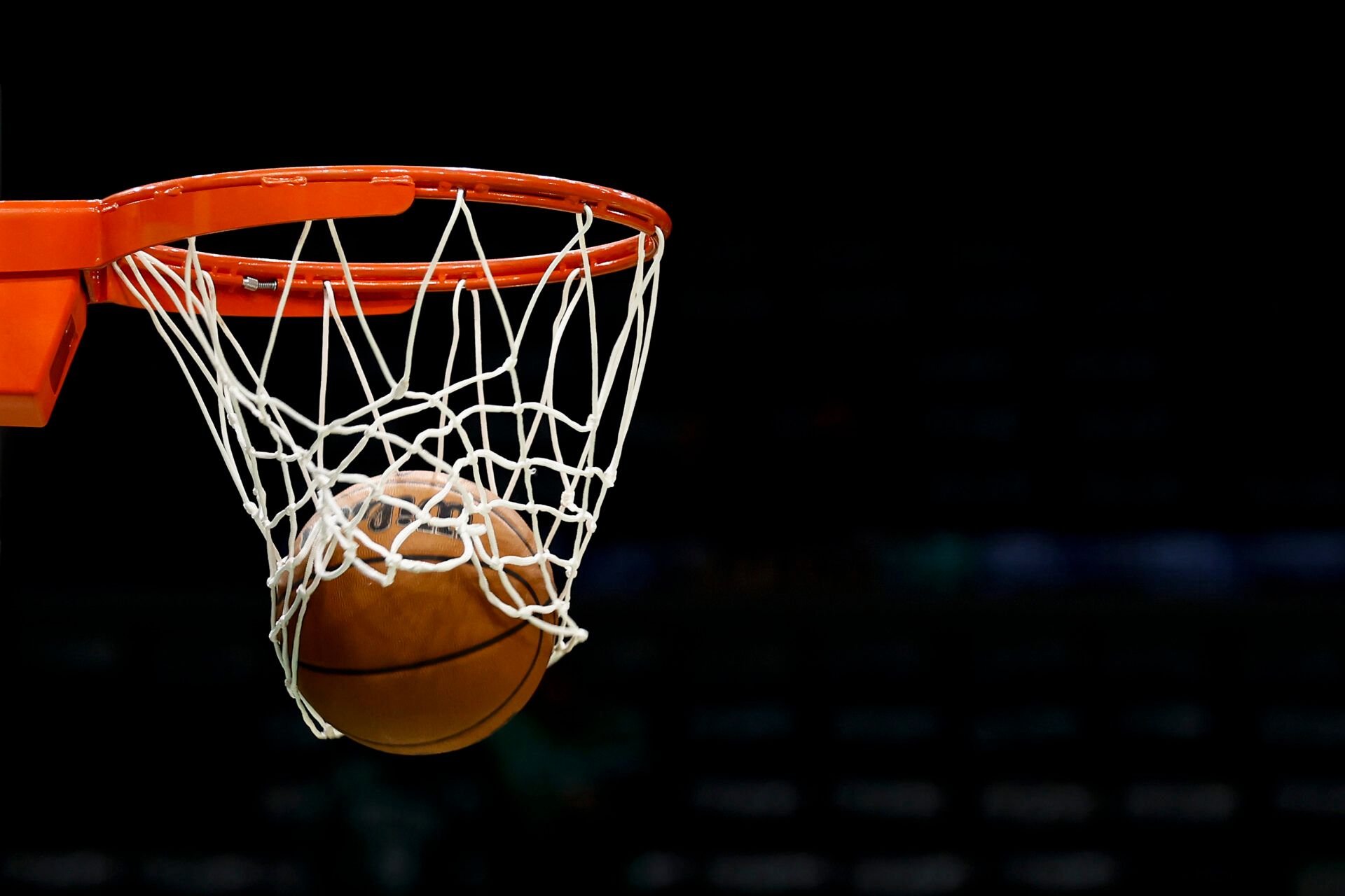 A Wilson NBA basketball goes through the net before the game between the Boston Celtics and the Philadelphia 76ers at TD Garden.