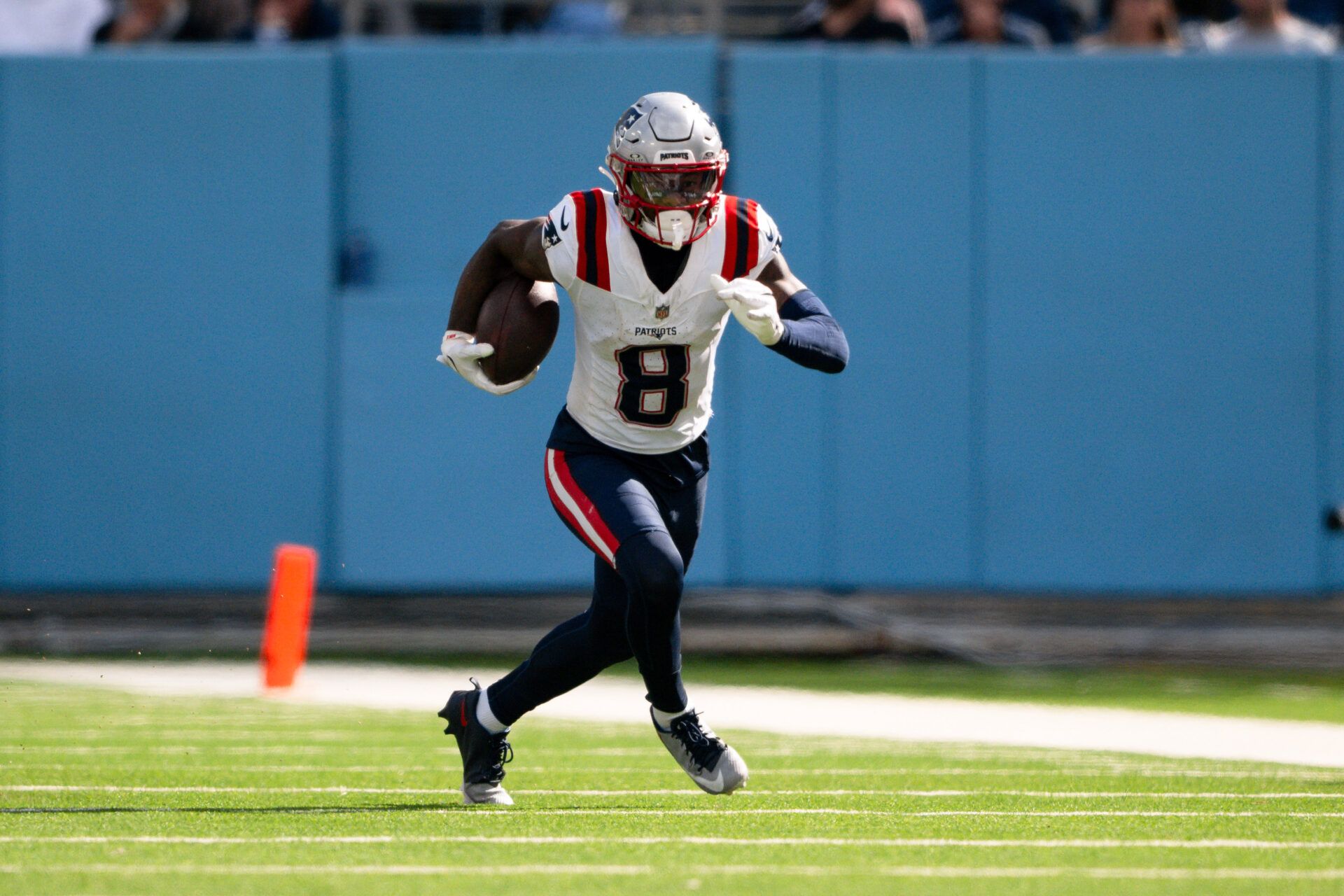 New England Patriots wide receiver Stefon Diggs (8) runs with the ball after a made catch against the Tennessee Titans during the second half at Nissan Stadium.