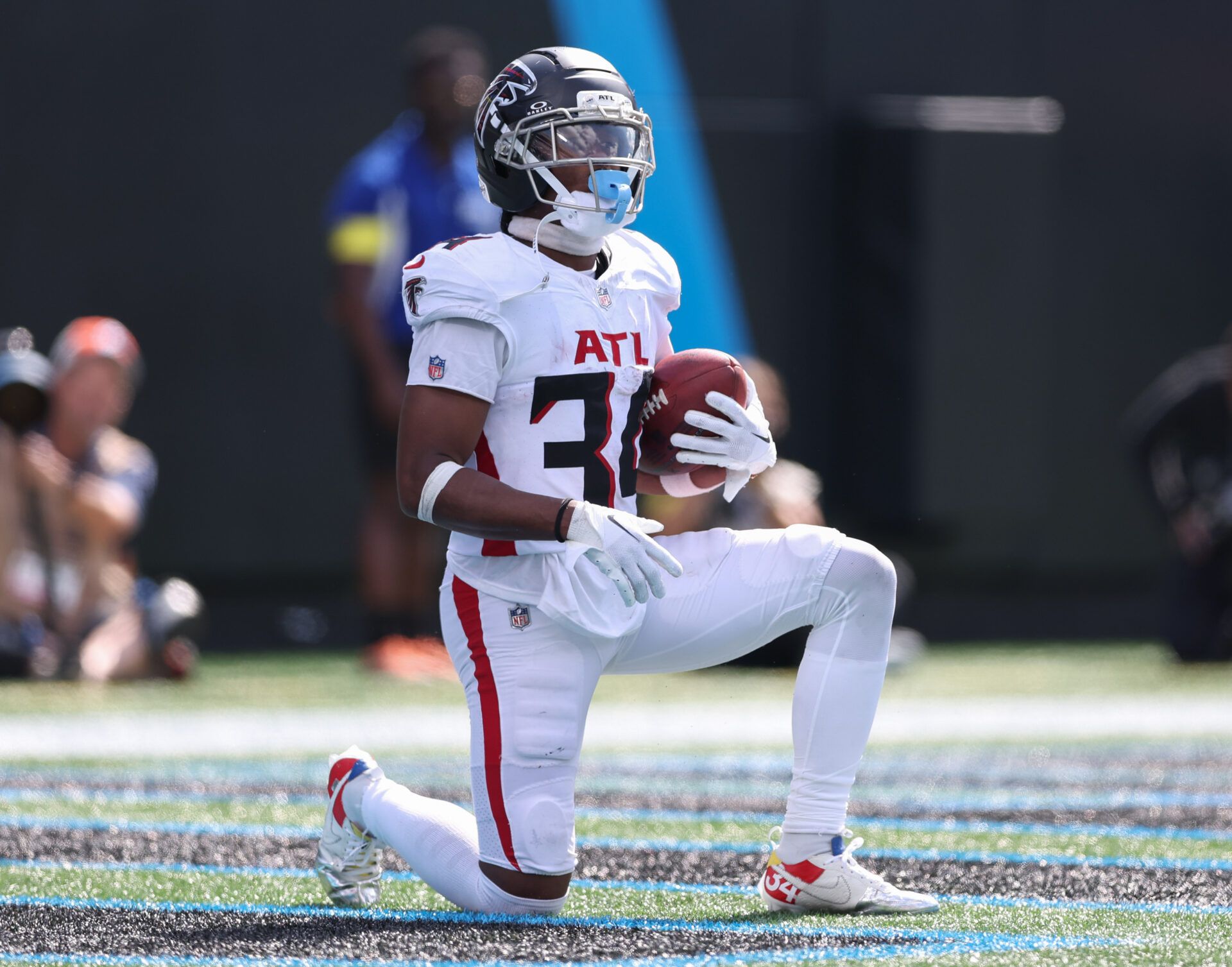 Atlanta Falcons wide receiver Ray-Ray McCloud (34) downs the ball after catching a punt during the second half of a game between Carolina Panthers and the Atlanta Falcons at Bank of America Stadium.