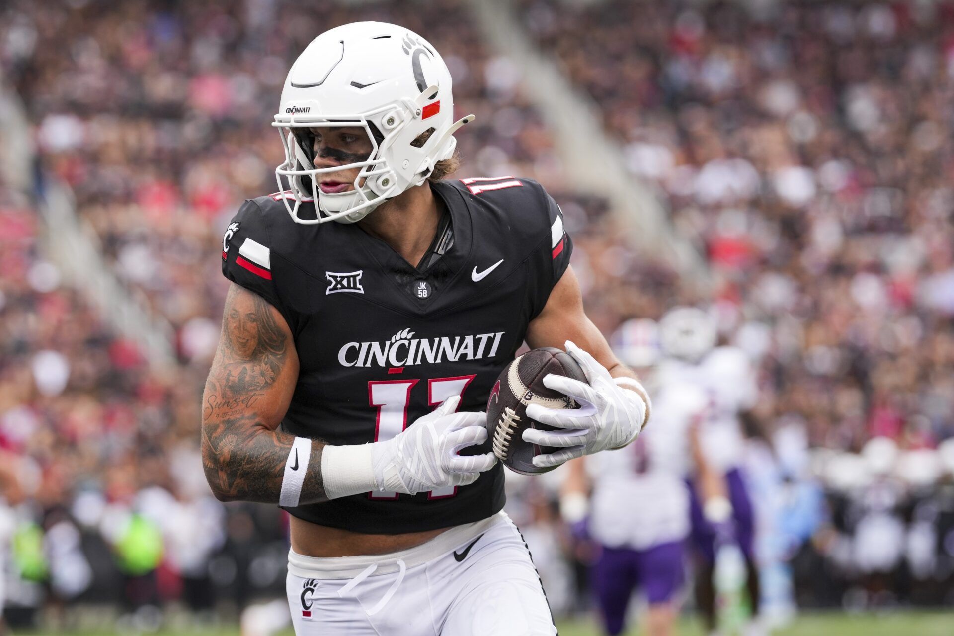 Cincinnati Bearcats tight end Joe Royer (11) catches a pass for a touchdown against the Northwestern State Demons in the first half at Nippert Stadium.