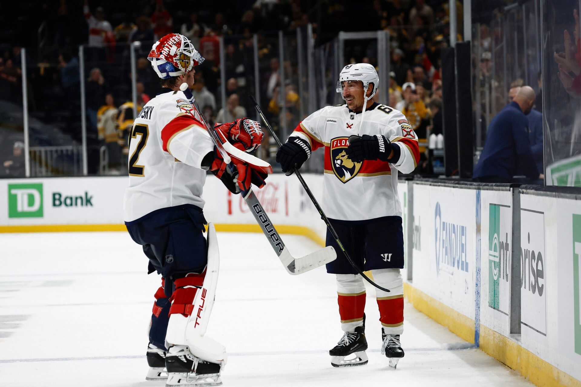 Florida Panthers left wing Brad Marchand (63) smiles as he congratulates goaltender Sergei Bobrovsky (72) after their 4-3 win over the Boston Bruins at TD Garden.