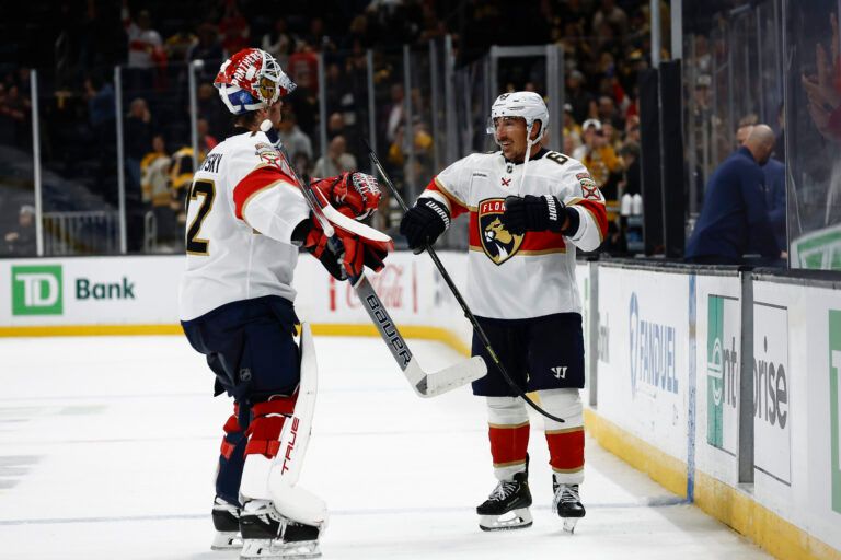 Florida Panthers left wing Brad Marchand (63) smiles as he congratulates goaltender Sergei Bobrovsky (72) after their 4-3 win over the Boston Bruins at TD Garden.