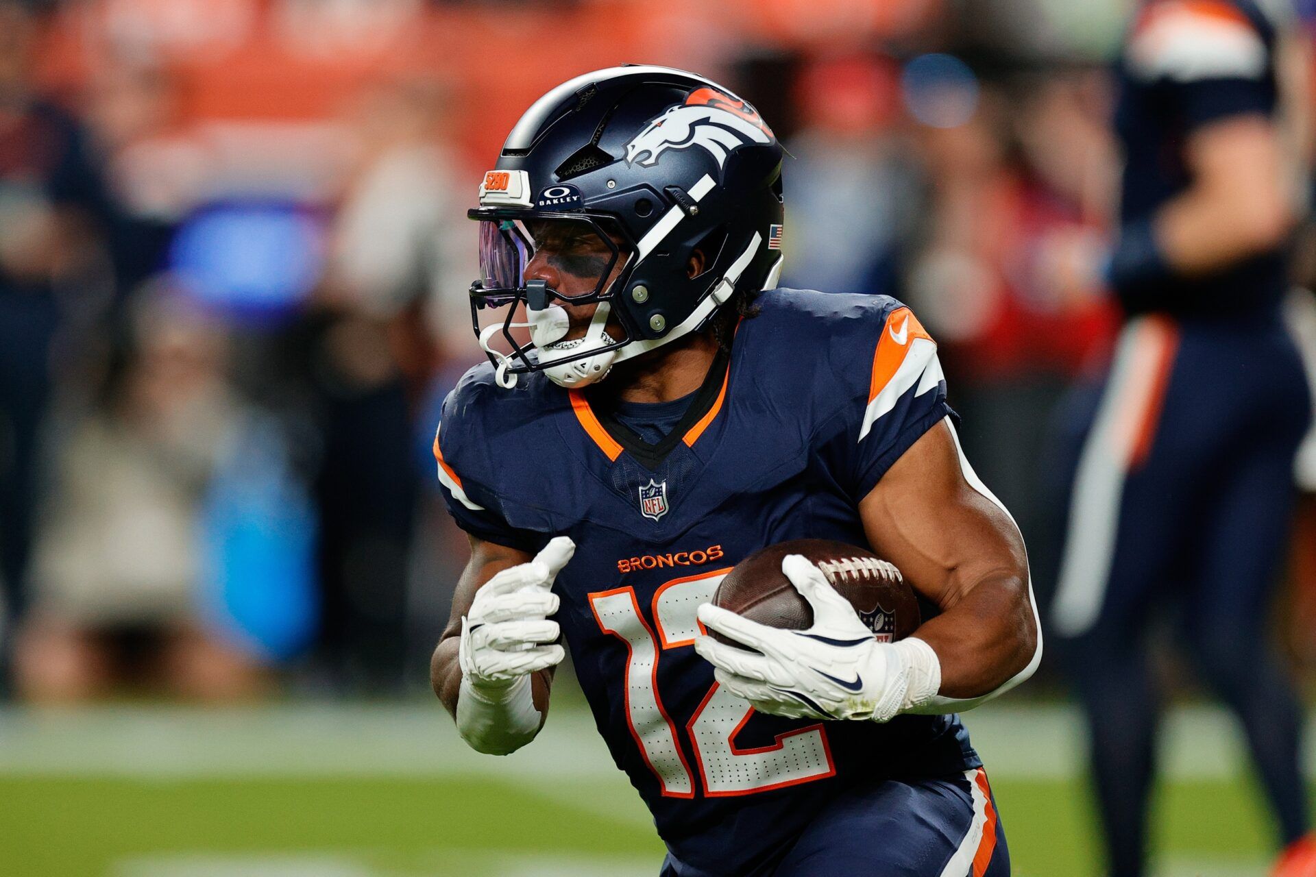 Denver Broncos running back RJ Harvey (12) rushes during the second quarter against the Cincinnati Bengals at Empower Field at Mile High.