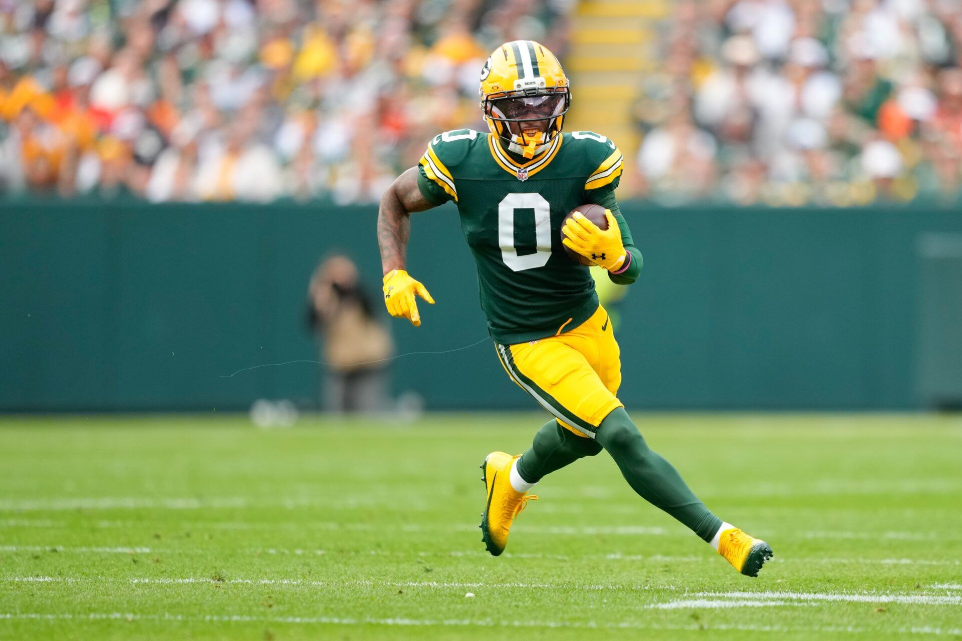 Green Bay Packers wide receiver Matthew Golden (0) runs with the ball during the first quarter against the Cincinnati Bengals at Lambeau Field.