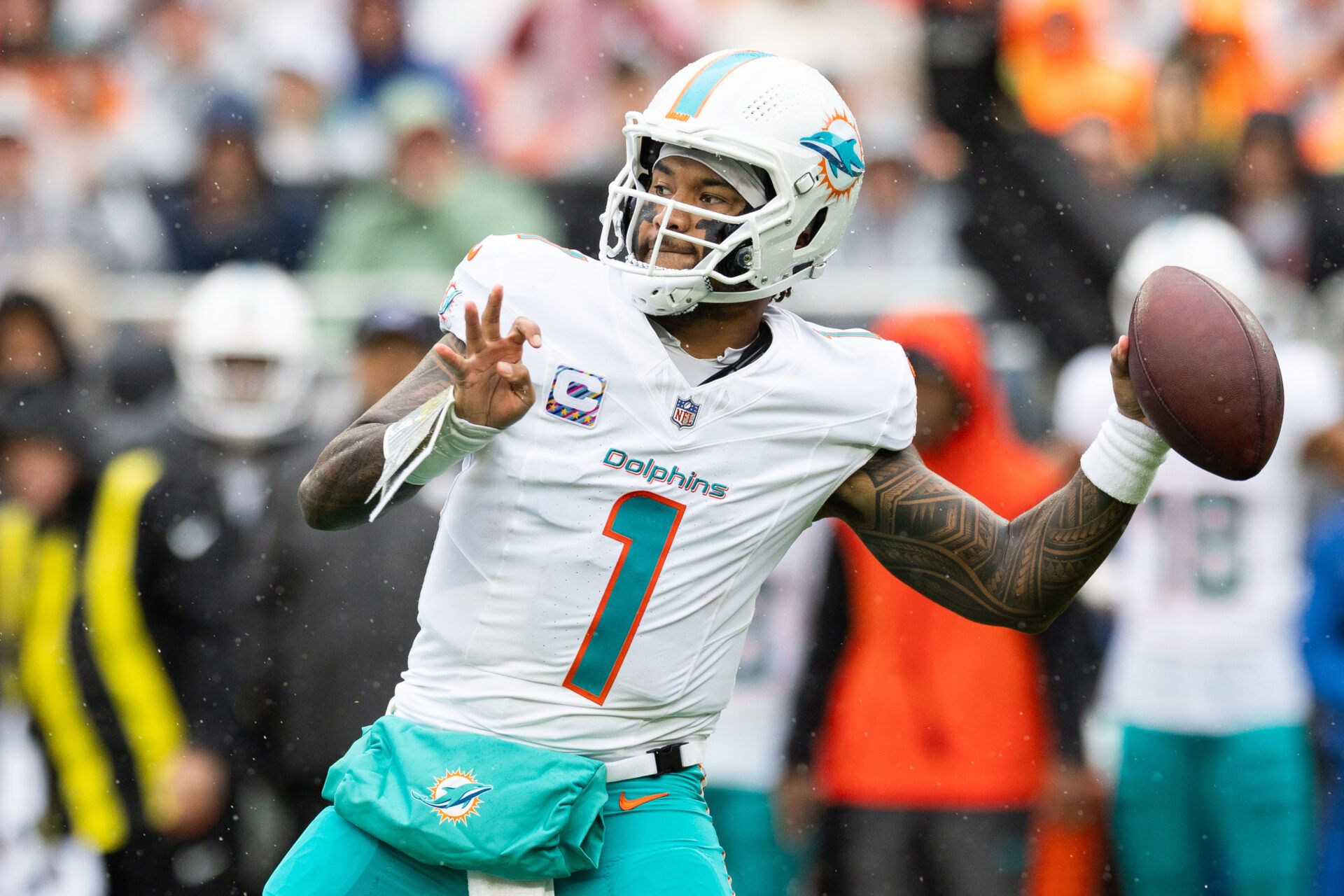 Miami Dolphins quarterback Tua Tagovailoa (1) throws a pass against the Cleveland Browns during the first quarter at Huntington Bank Field.