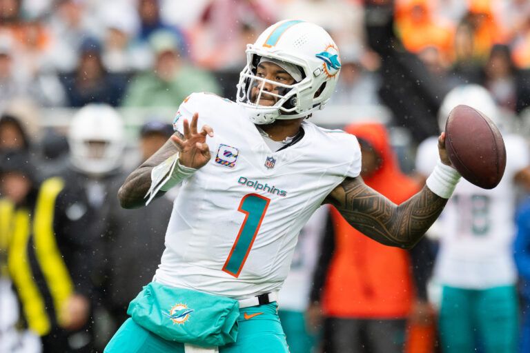 Miami Dolphins quarterback Tua Tagovailoa (1) throws a pass against the Cleveland Browns during the first quarter at Huntington Bank Field.