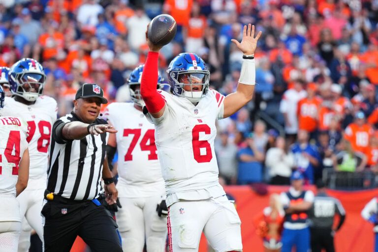 New York Giants quarterback Jaxson Dart (6) reacts after a play against the Denver Broncos at Empower Field at Mile High.