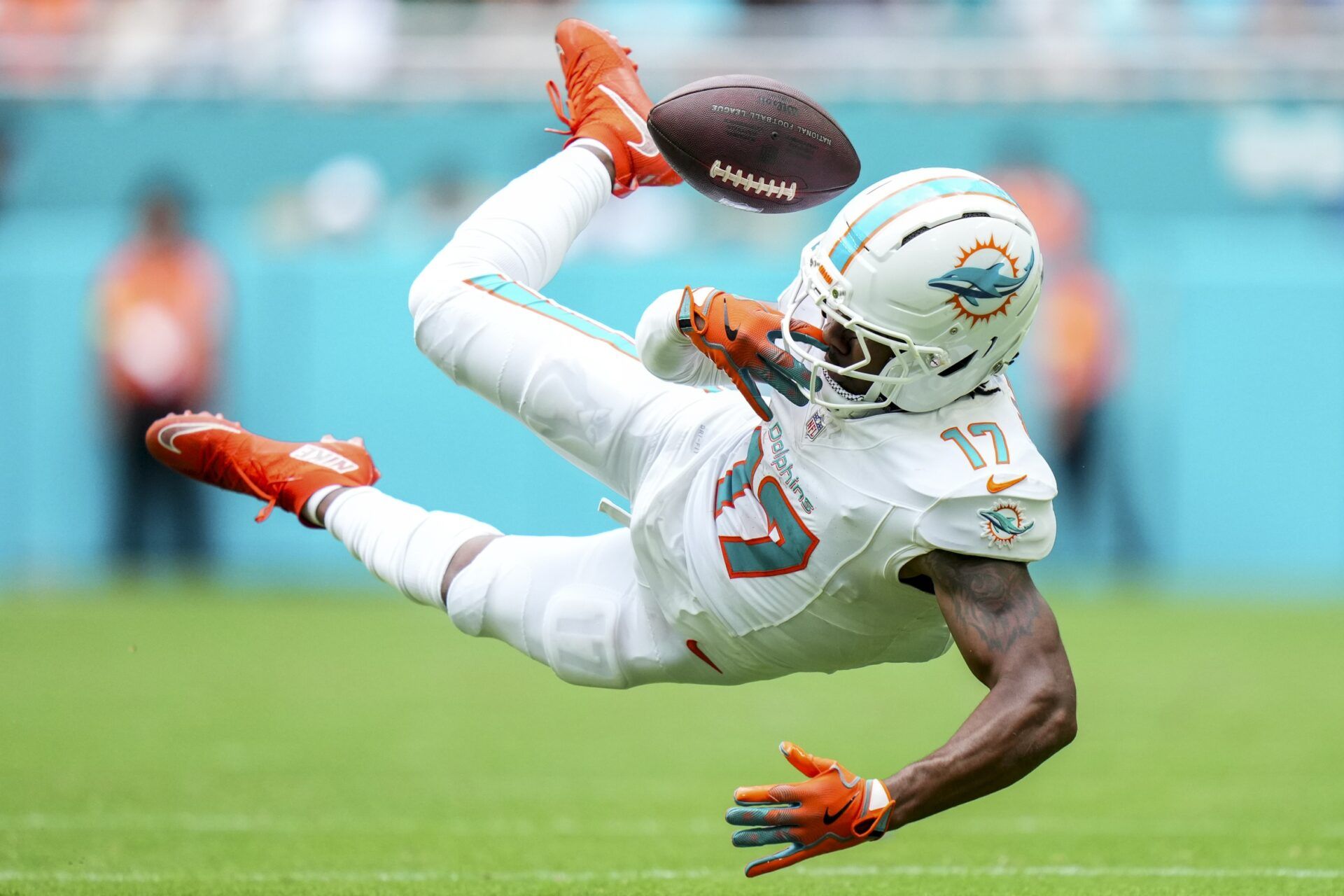 Miami Dolphins wide receiver Jaylen Waddle (17) juggles a ctach against the Los Angeles Chargers during the second quarter at Hard Rock Stadium.