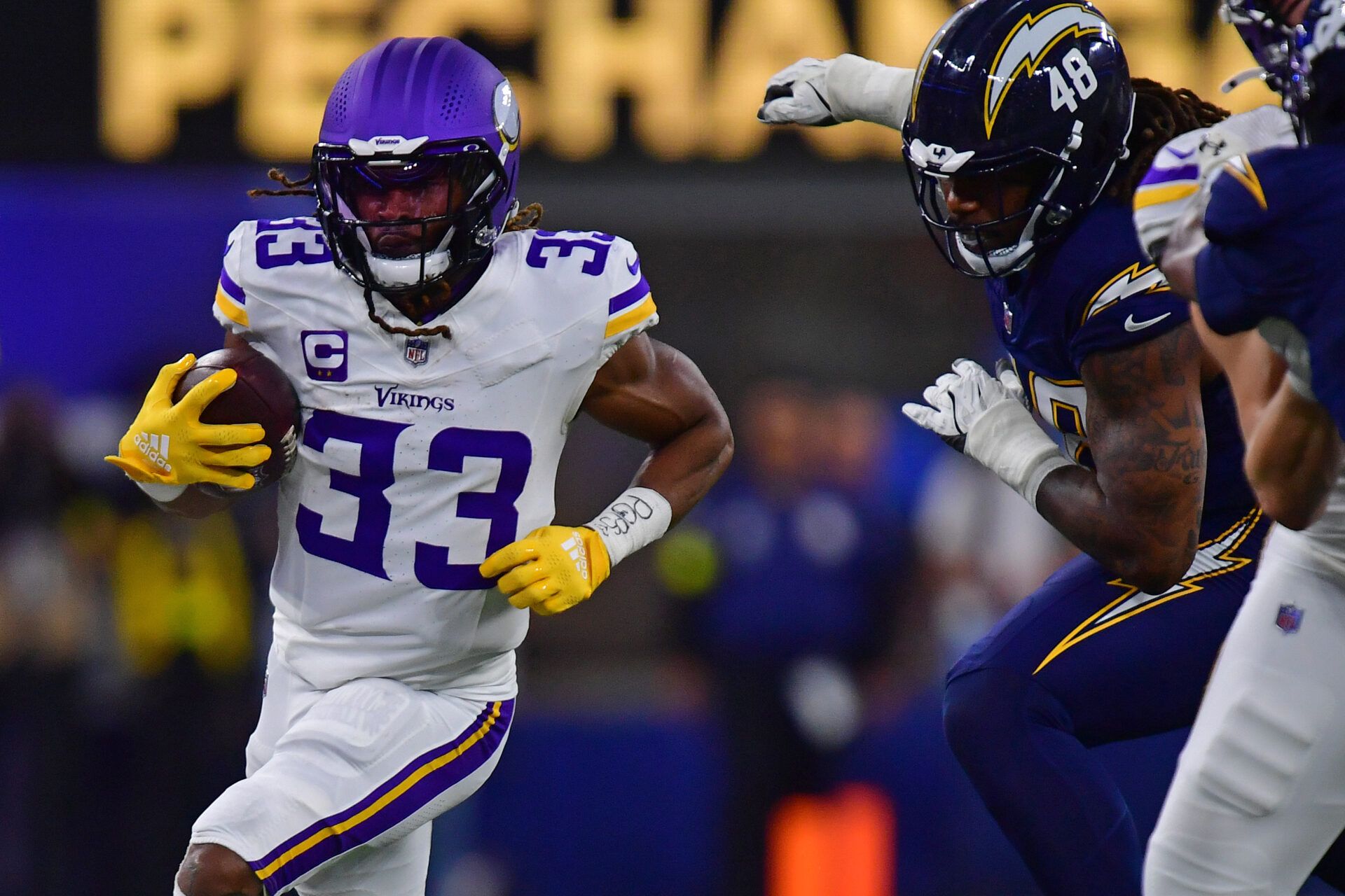 Minnesota Vikings running back Aaron Jones Sr. (33) rushes the ball against the Los Angeles Chargers during the first half at SoFi Stadium.