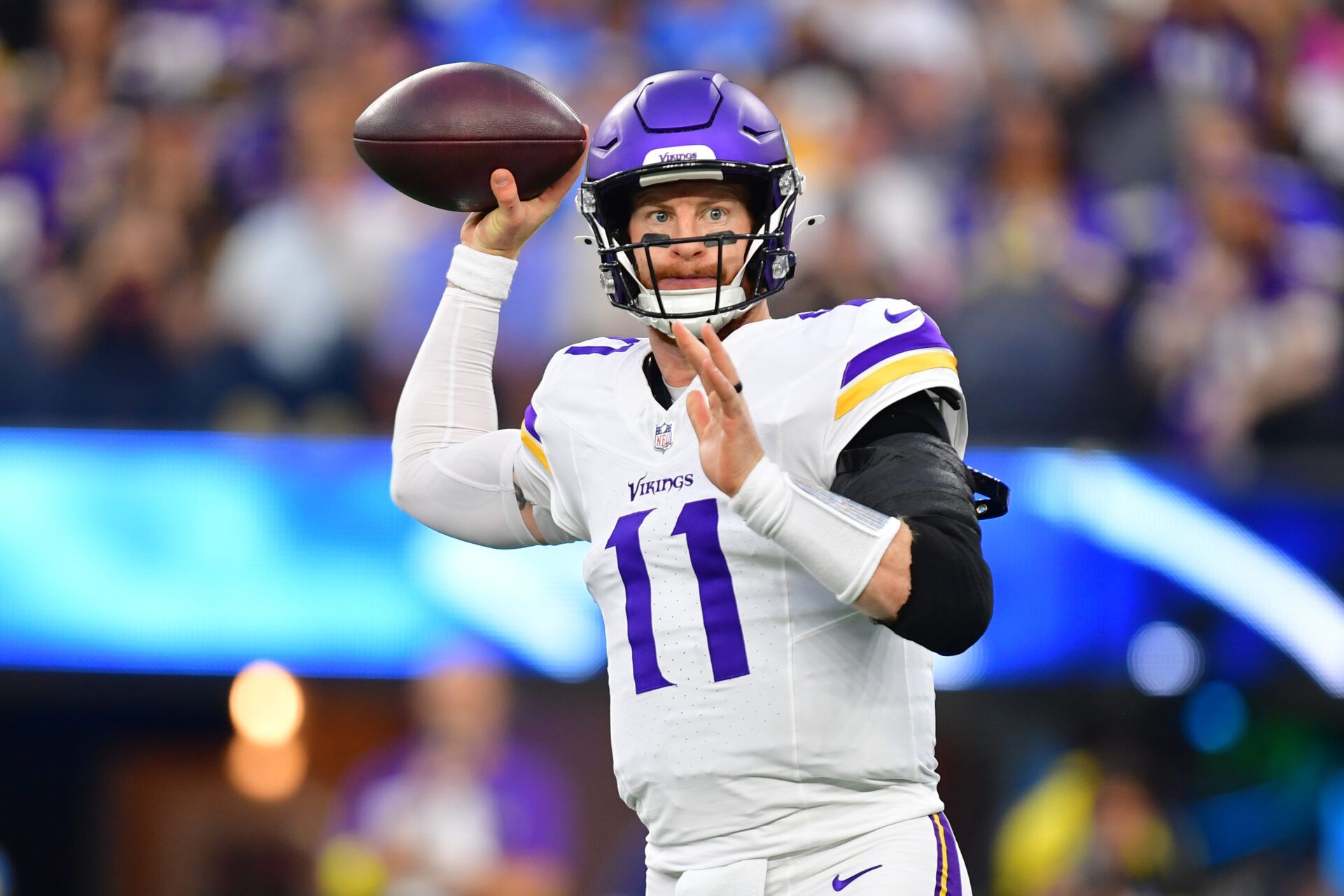 Minnesota Vikings quarterback Carson Wentz (11) drops back to pass against the Los Angeles Chargers during the first half at SoFi Stadium.