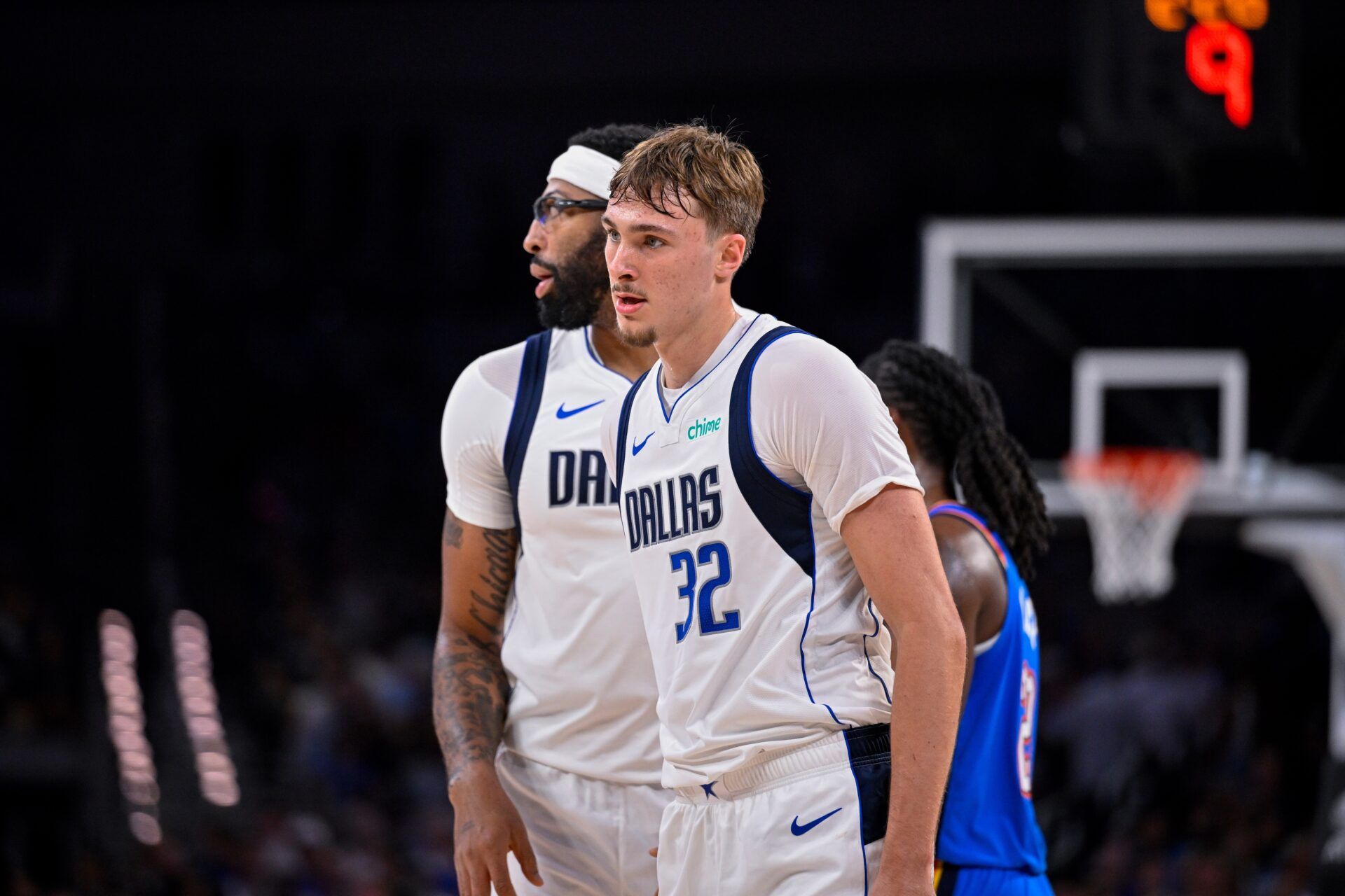 Dallas Mavericks forward/center Anthony Davis (3) hugs forward Cooper Flagg (32) during the game between the Dallas Mavericks and the Oklahoma City Thunder at Dickie's Arena.