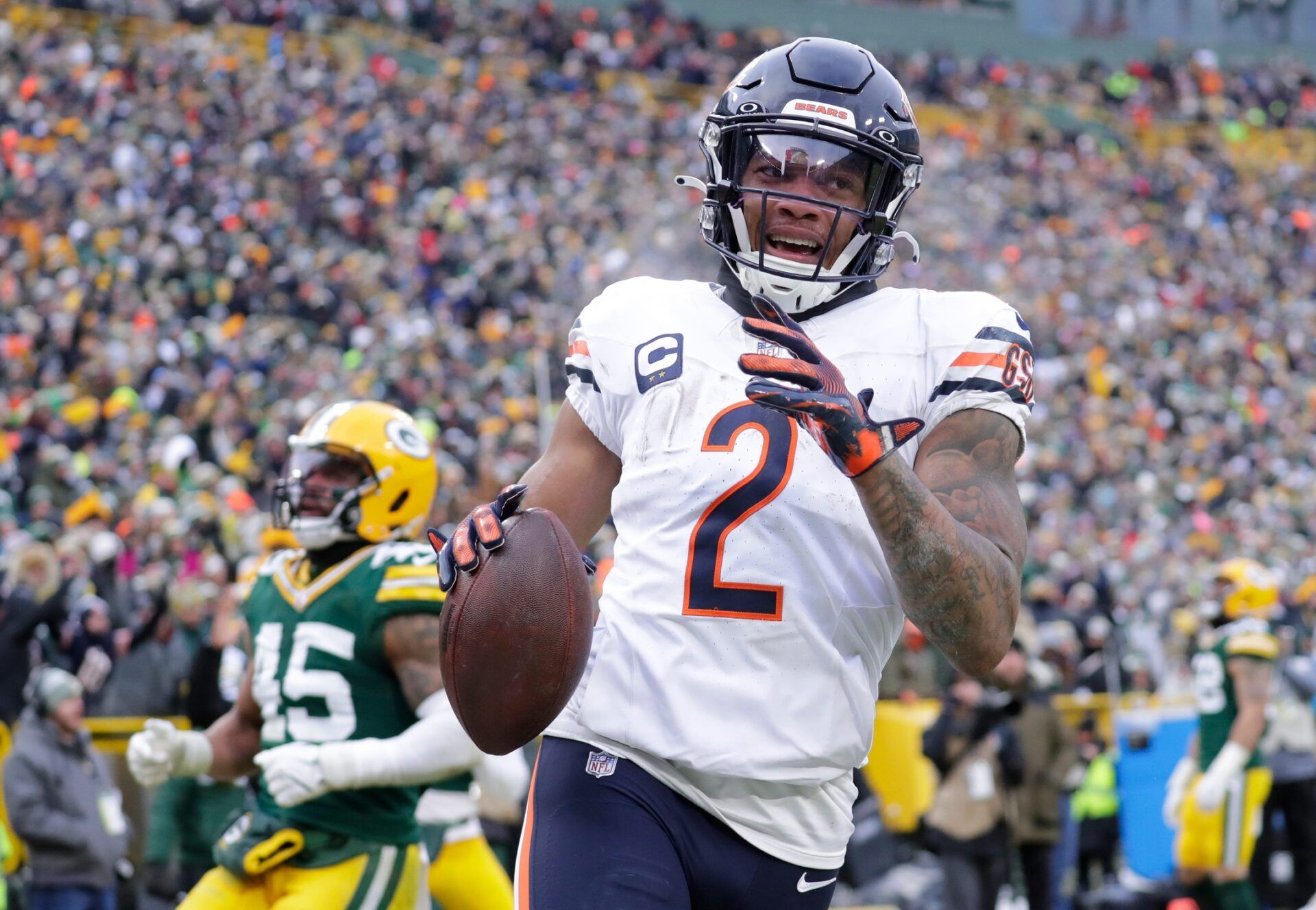 Chicago Bears wide receiver DJ Moore (2) scores a touchdown on a reception against the Green Bay Packers in the fourth quarter during their football game Sunday, January 5, 2025, at Lambeau Field in Green Bay, Wisconsin.