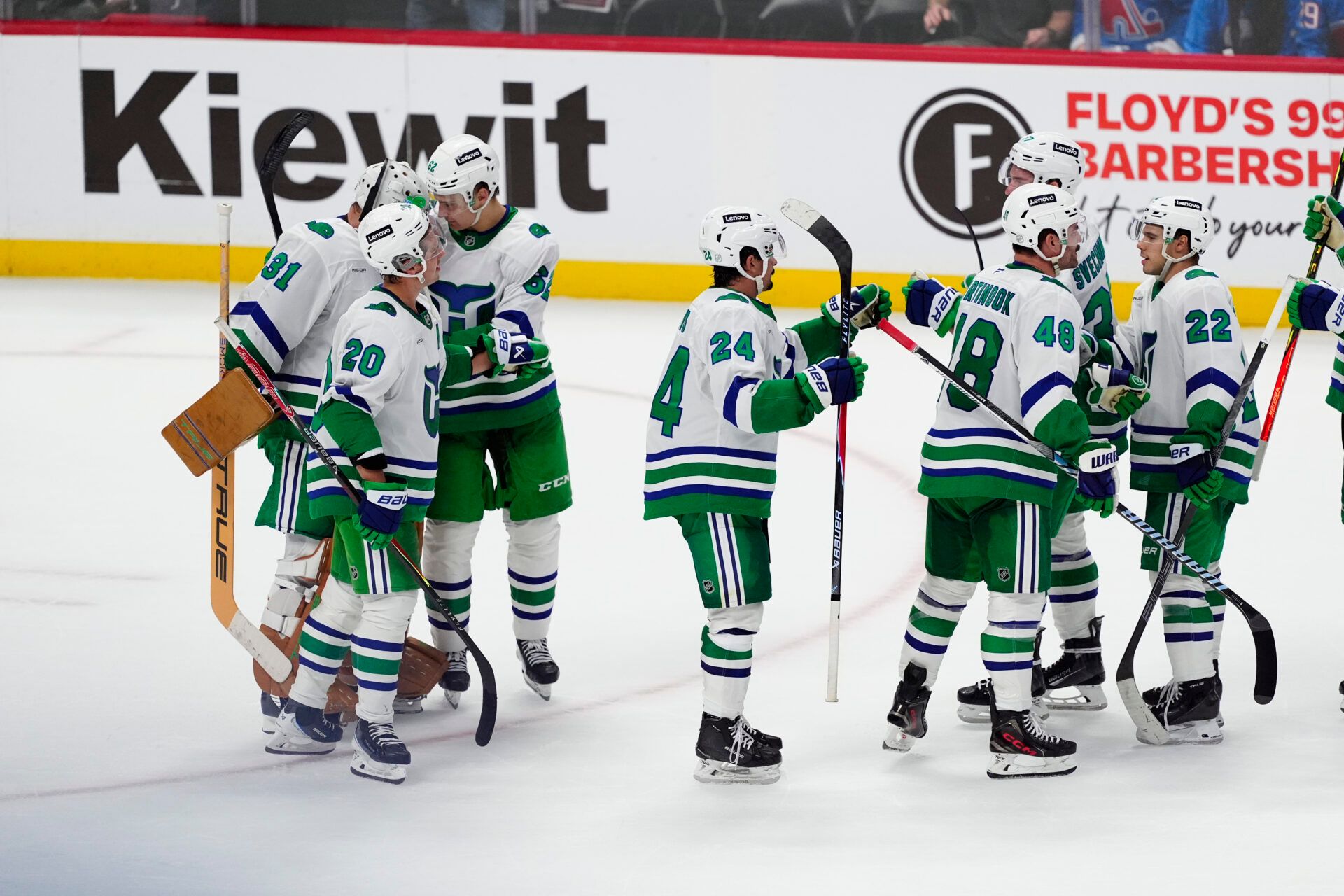 Members of the Carolina Hurricanes celebrate defeating the Colorado Avalanche in a shoot out at Ball Arena.