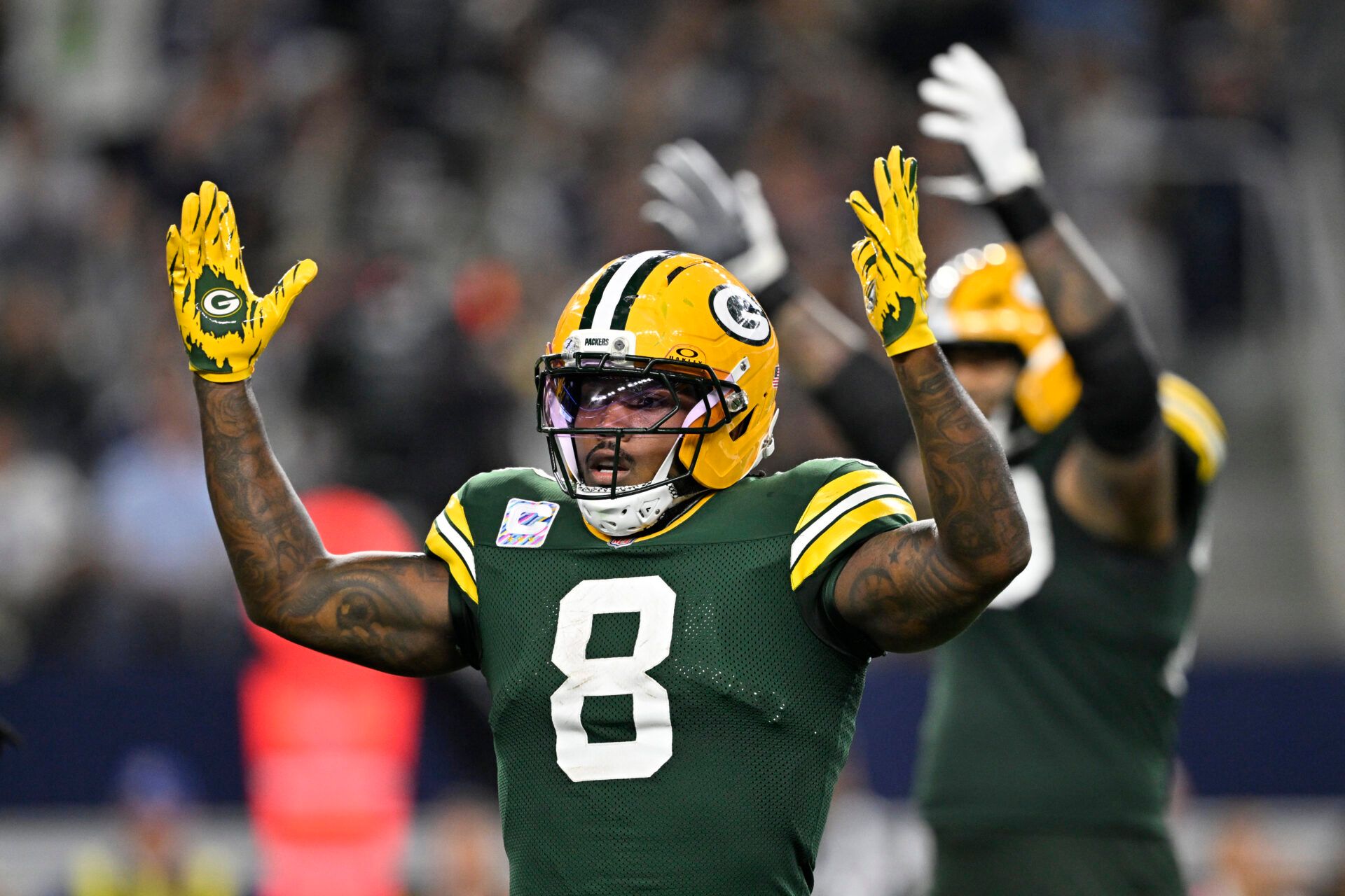Green Bay Packers running back Josh Jacobs (8) celebrates after a touchdown against the Dallas Cowboys in the third quarter at AT&T Stadium.