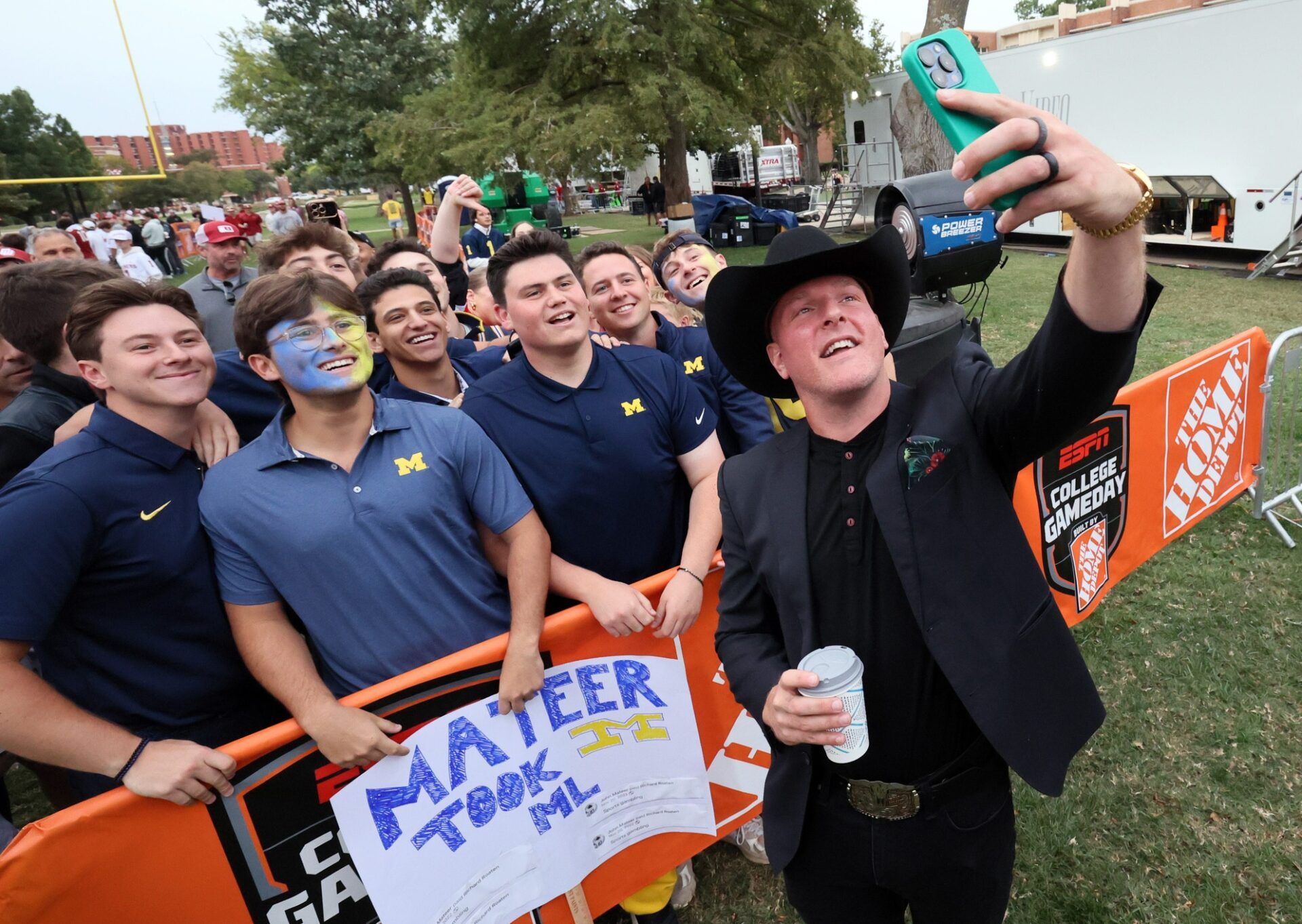 Pat McAfee takes a selfie with Michigan fans on his way to the stage at ESPN College GameDay ahead of the University of Oklahoma-Michigan College football game on Sep 6, 2025 in Norman.