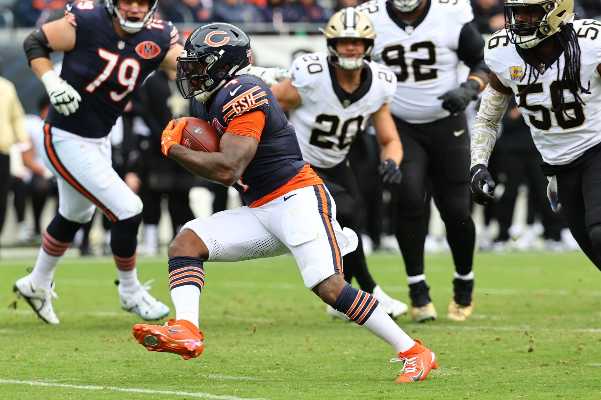 Chicago Bears running back D'Andre Swift (4) rushes the ball against the New Orleans Saints during the second half at Soldier Field.