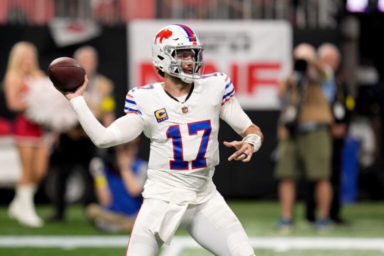 Buffalo Bills quarterback Josh Allen (17) throws downfield against the Atlanta Falcons during the first half of a game at Mercedes-Benz Stadium.