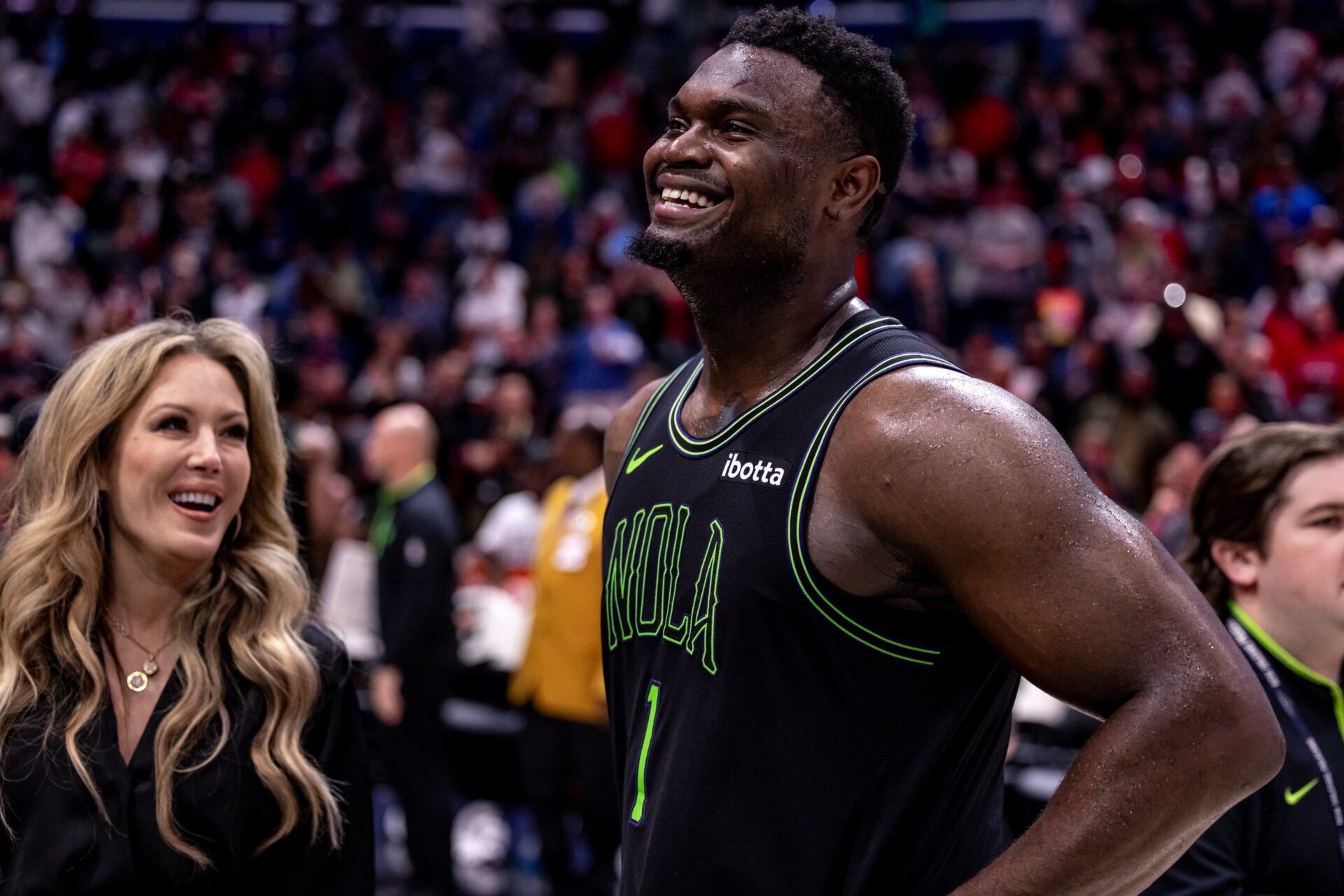 New Orleans Pelicans forward Zion Williamson (1) is interviewed by the media after the game at Smoothie King Center.