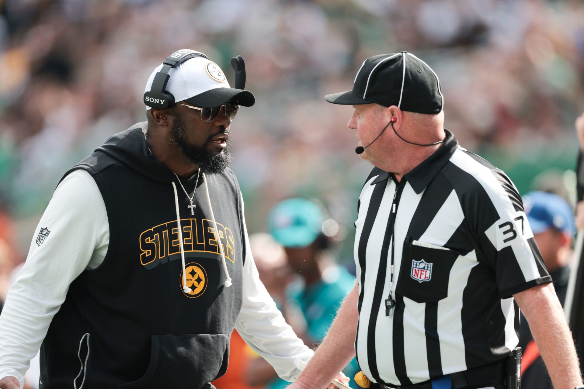 Pittsburgh Steelers head coach Mike Tomlin speaks with the referee during the second half against the New York Jets at MetLife Stadium.