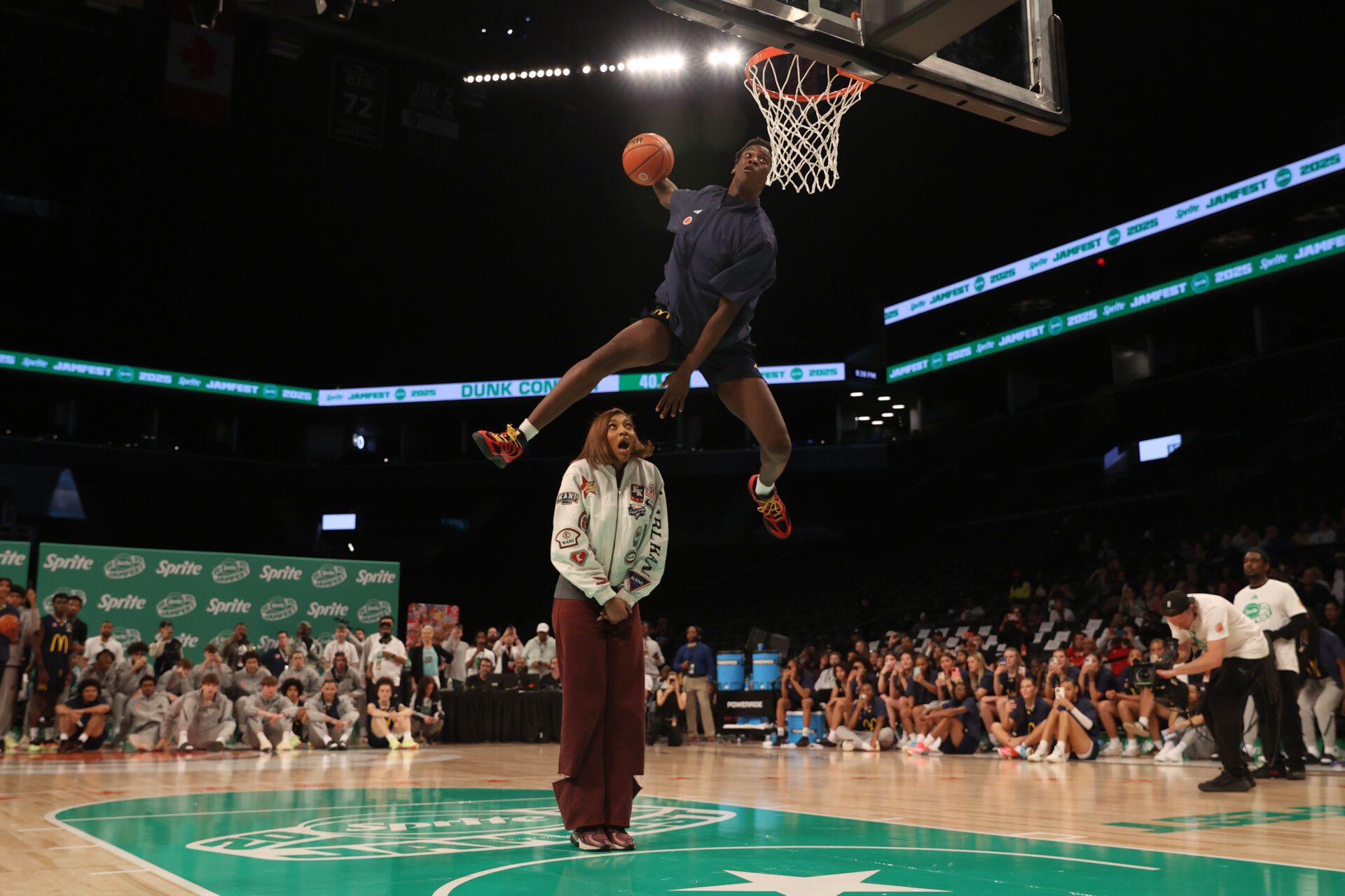 McDonald’s All American West forward AJ Dybantsa (3) dunks the ball over  Chicago Sky forward Angel Reese during the Sprite Jam Fest at Barclay's Center.