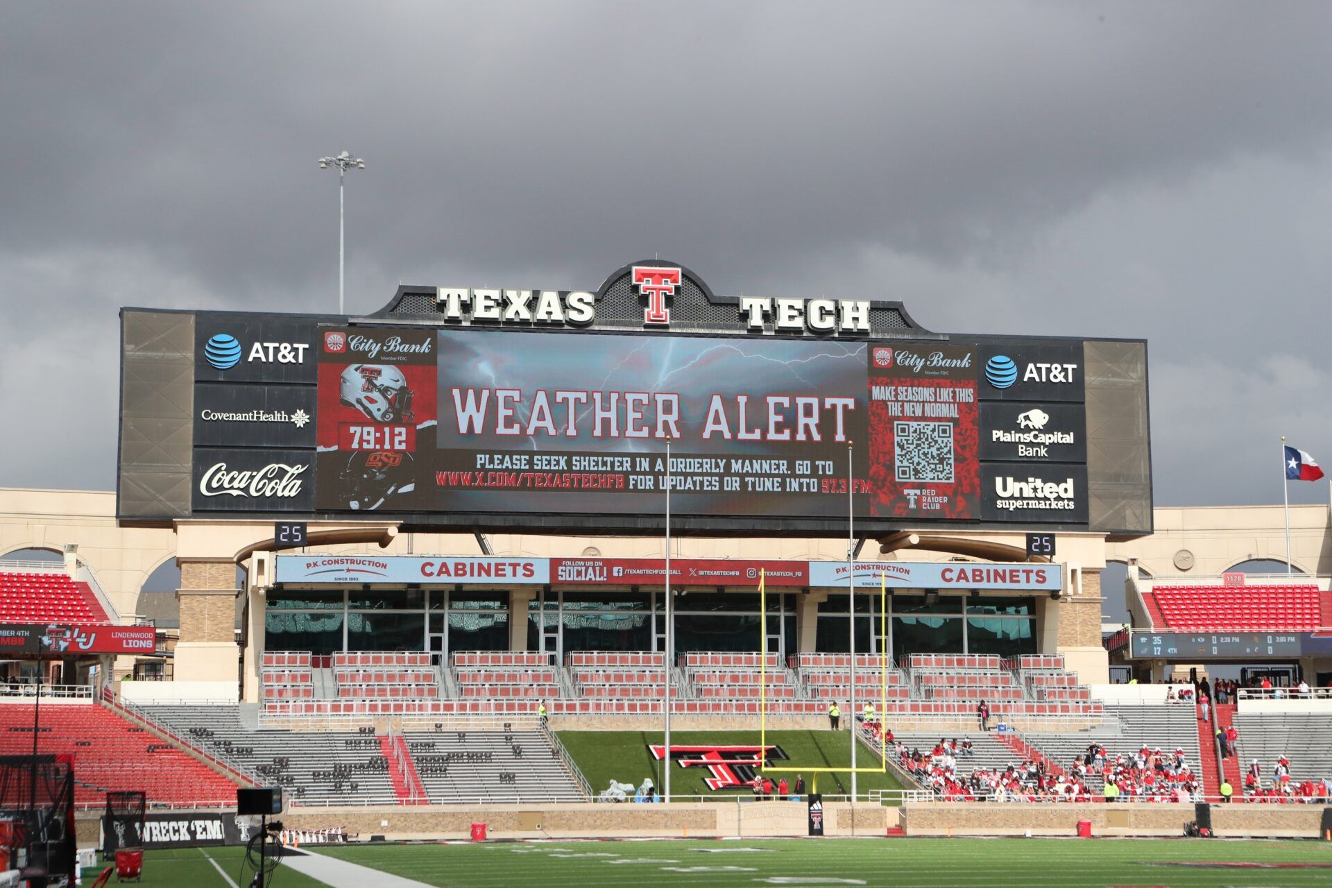 A general view of the video scoreboard during a weather delay before the game between the Oklahoma State Cowboys and the Texas Tech Red Raiders at Jones AT&T Stadium.