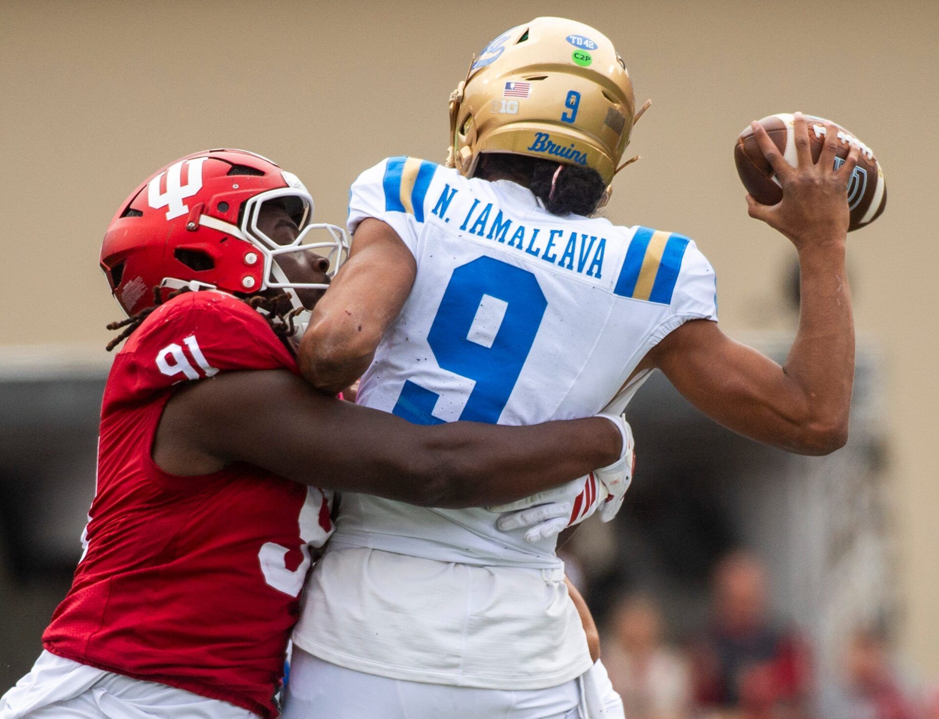 Indiana's Dominique Ratcliff (91) pressures UCLA's Nico Iamaleava (9) during the Indiana versus UCLA football game at Memorial Stadium on Saturday, Oct. 25, 2025.