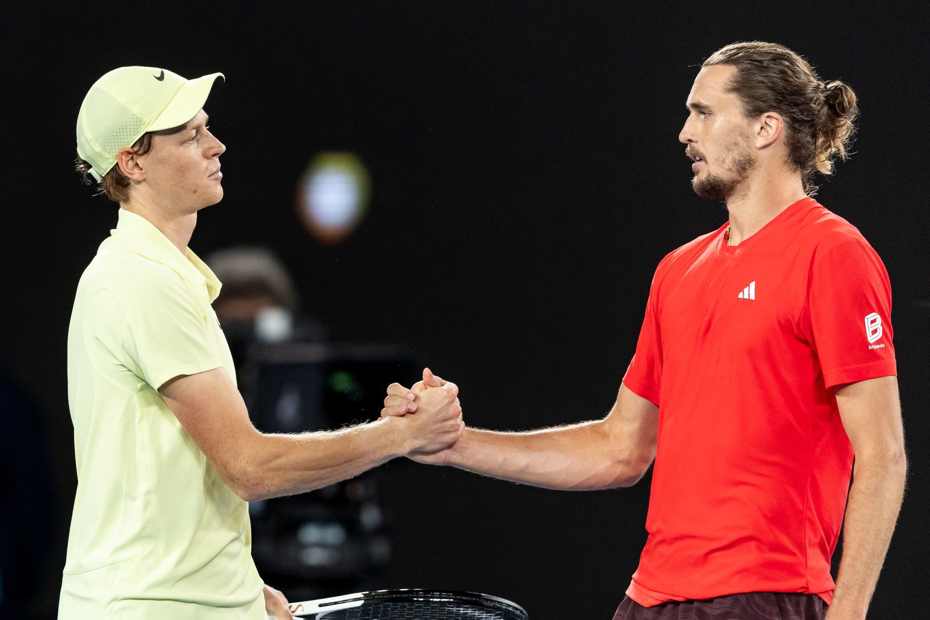 Jannik Sinner of Italy and Alexander Zverev of Germany shake hands after their match in the final of the men's singles at the 2025 Australian Open at Melbourne Park.