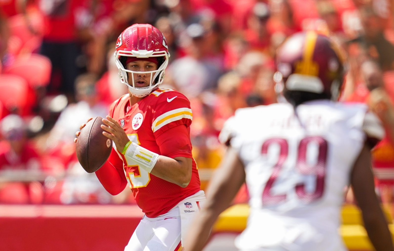Kansas City Chiefs quarterback Patrick Mahomes (15) drops back to pass against the Washington Commanders during the first half at GEHA Field at Arrowhead Stadium.