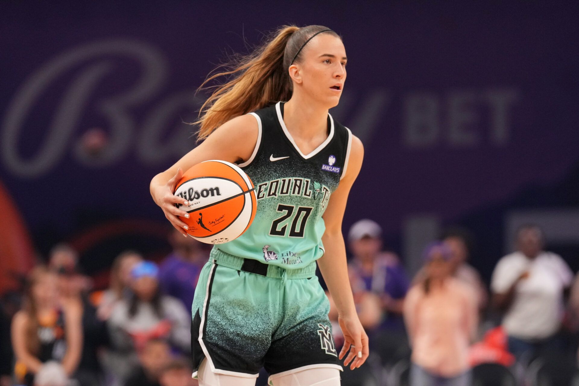 New York Liberty guard Sabrina Ionescu (20) dribbles against the Phoenix Mercury during the first half of game three of round one for the 2025 WNBA Playoffs at PHX Arena.