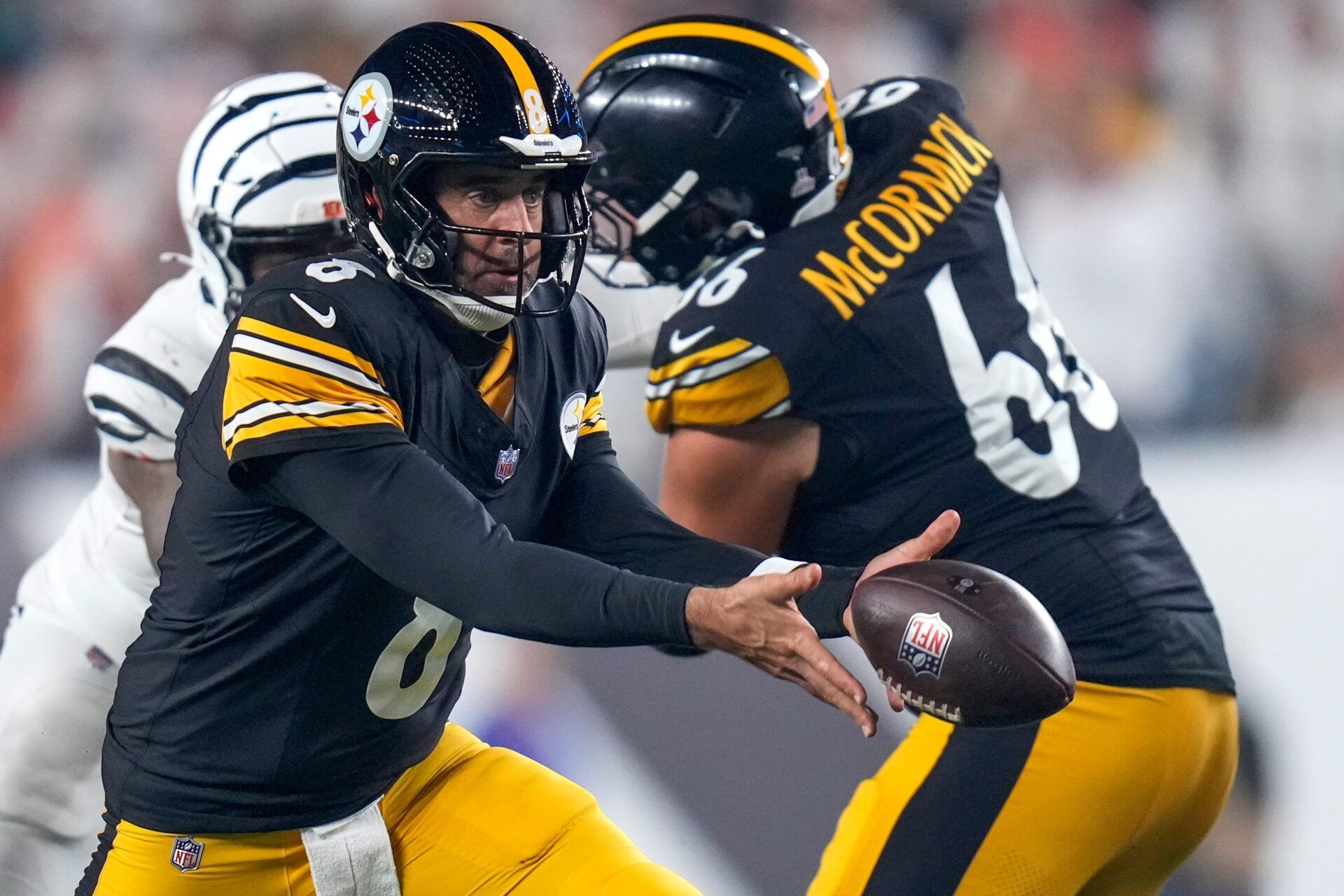 Pittsburgh Steelers quarterback Aaron Rodgers (8) tosses back in the fourth quarter of the NFL Week 7 game between the Cincinnati Bengals and the Pittsburgh Steelers at Paycor Stadium in downtown Cincinnati on Thursday, Oct. 16, 2025. The Bengals won, 33-31.
