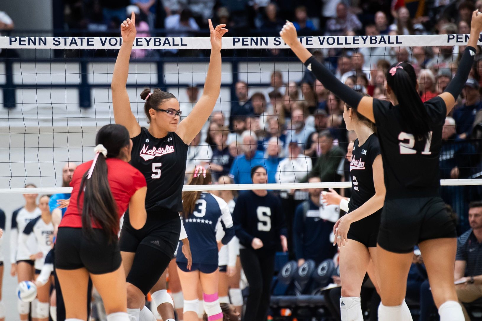 Nebraska players, including Rebekah Allick (5), celebrate a point in the first set of a Big Ten volleyball match against Penn State at Rec Hall on Friday, Nov. 29, 2024, in State College, Pa.