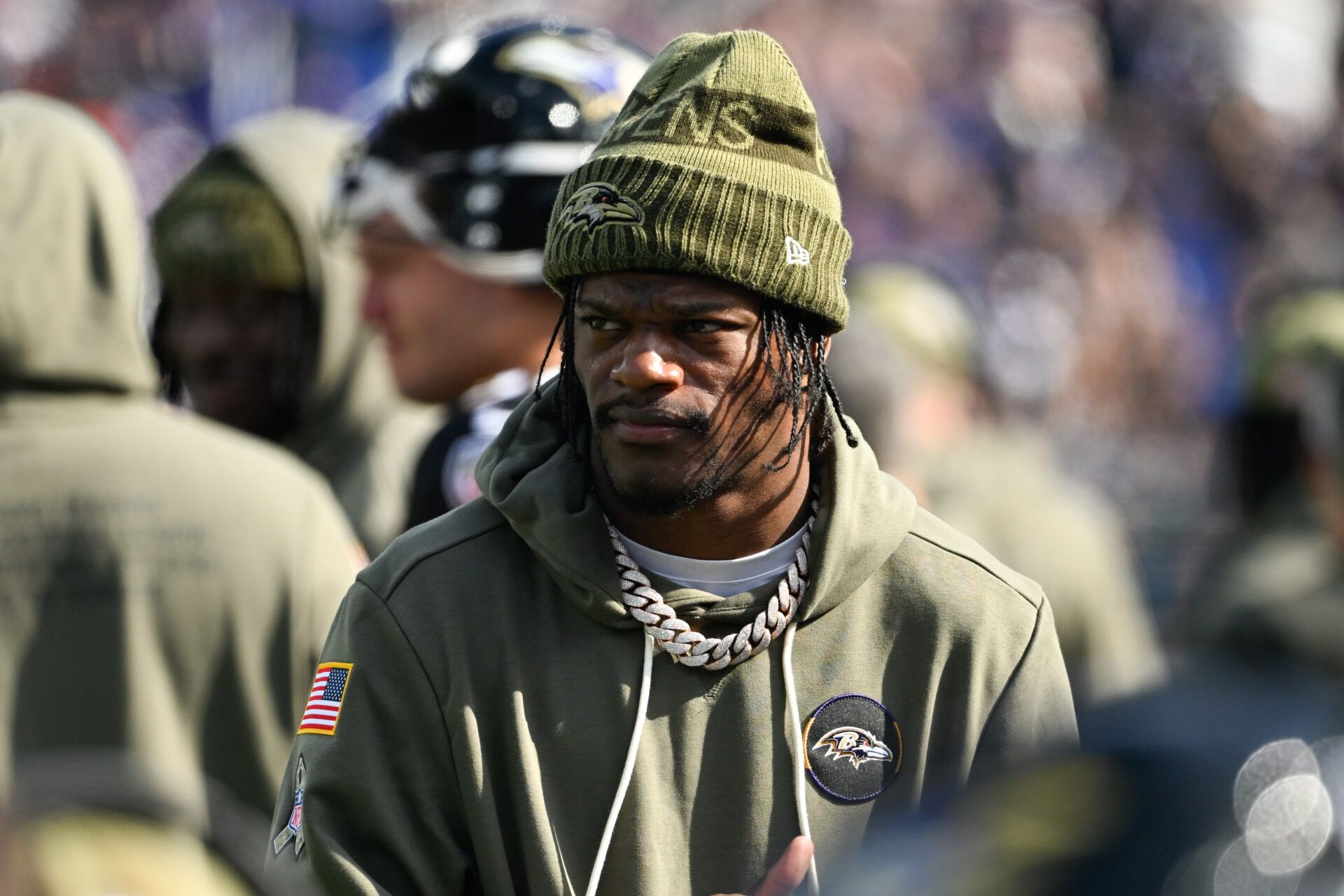 Baltimore Ravens quarterback Lamar Jackson (8) looks on from the sideline during the first quarter against the Chicago Bears at M&T Bank Stadium.