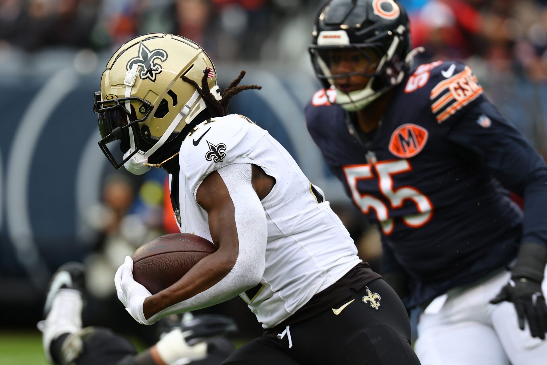New Orleans Saints running back Alvin Kamara (41) rushes the ball against the Chicago Bears during the first quarter at Soldier Field.