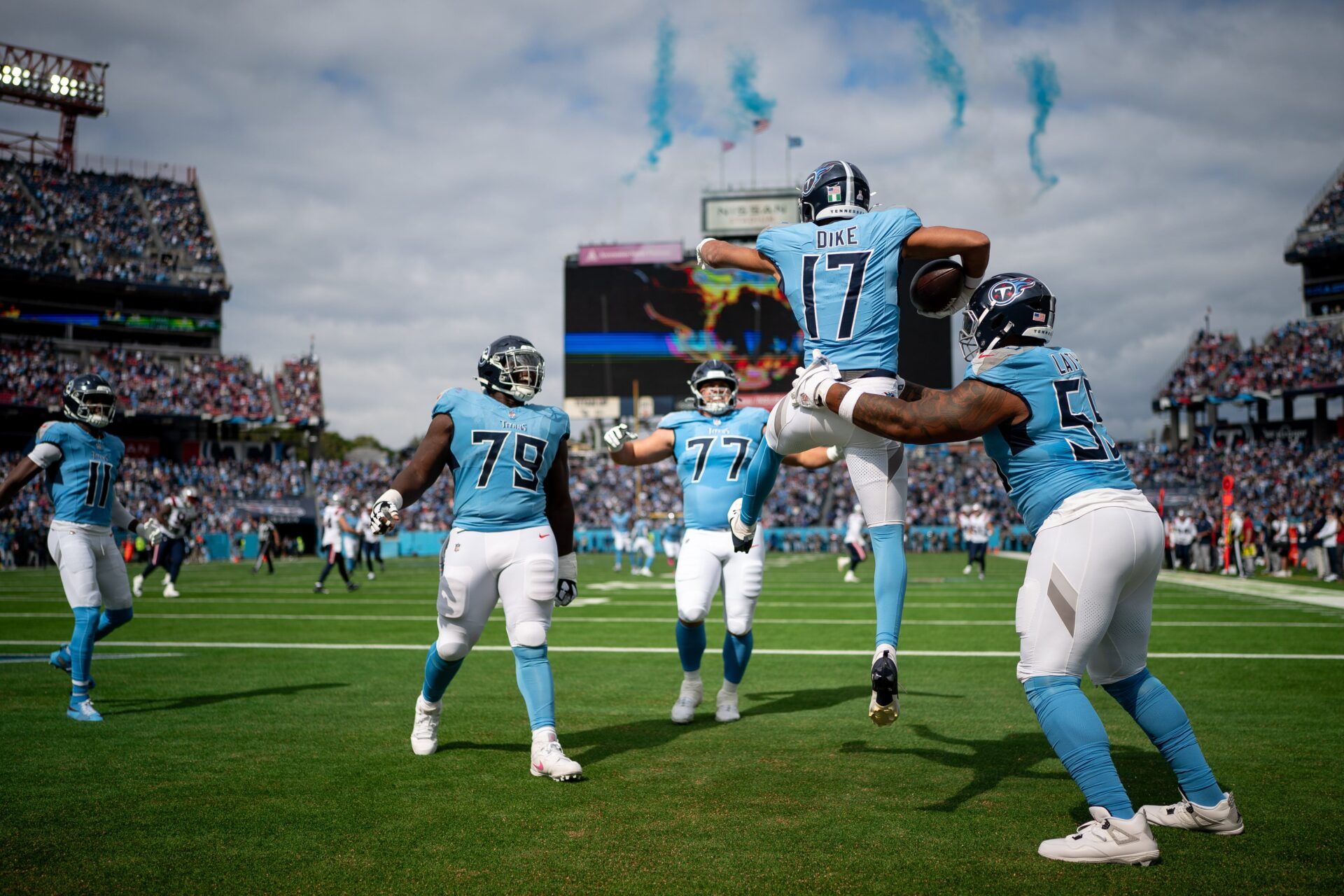Tennessee Titans wide receiver Chimere Dike (17) celebrates his touchdown against the New England Patriots during the first quarter at Nissan Stadium in Nashville, Tenn., Sunday, Oct. 19, 2025.