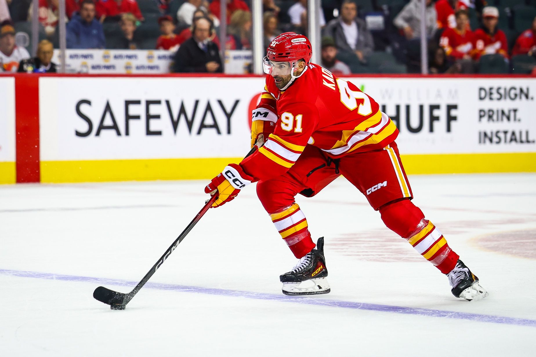 Calgary Flames center Nazem Kadri (91) controls the puck against the Winnipeg Jets during the overtime period at Scotiabank Saddledome.