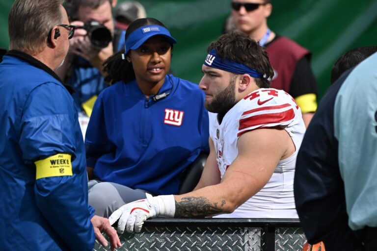 New York Giants running back Cam Skattebo (44) is carted off the field with a leg injury during the second quarter against the Philadelphia Eagles at Lincoln Financial Field.