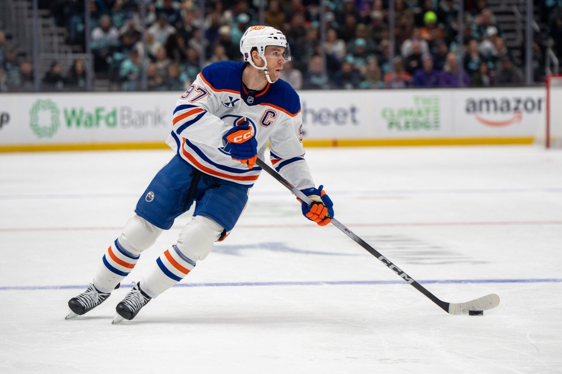 Edmonton Oilers forward Connor McDavid (97) skates with the puck during the first period against the Seattle Kraken at Climate Pledge Arena.