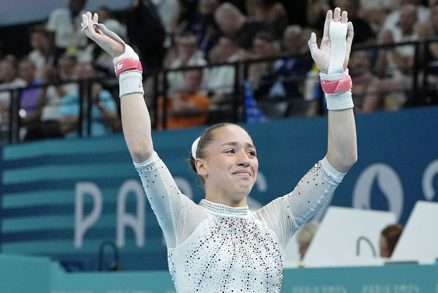 Kaylia Nemour of Algeria reacts after competing on the uneven bars on the second day of gymnastics event finals during the Paris 2024 Olympic Summer Games at Bercy Arena.
